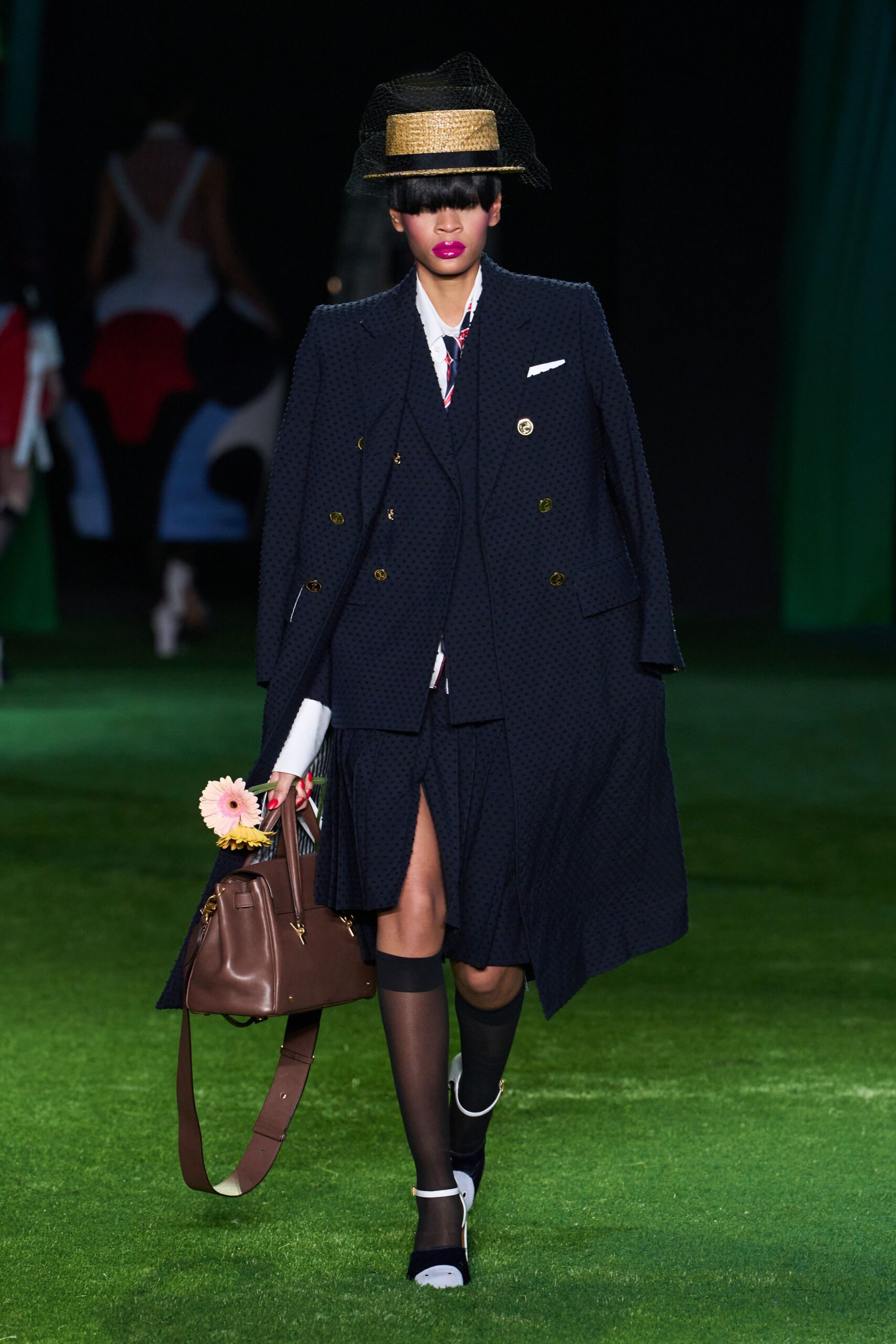 navy cape blazer with pleated skirt