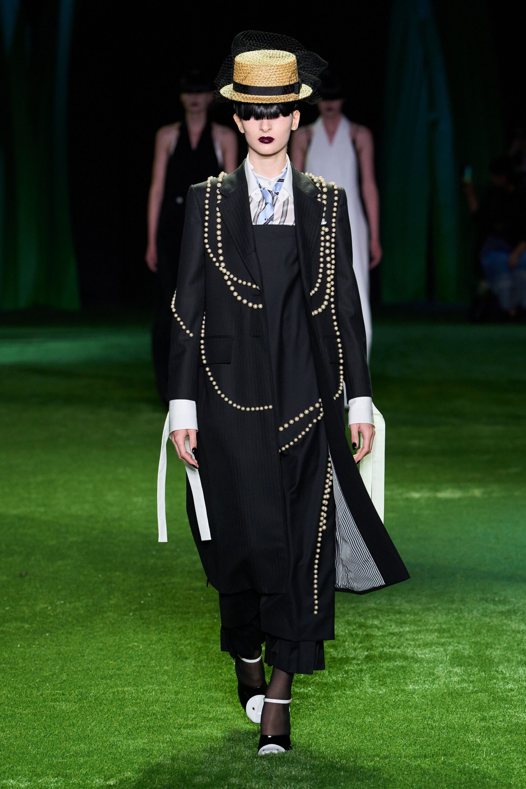 pearl-trim black overcoat