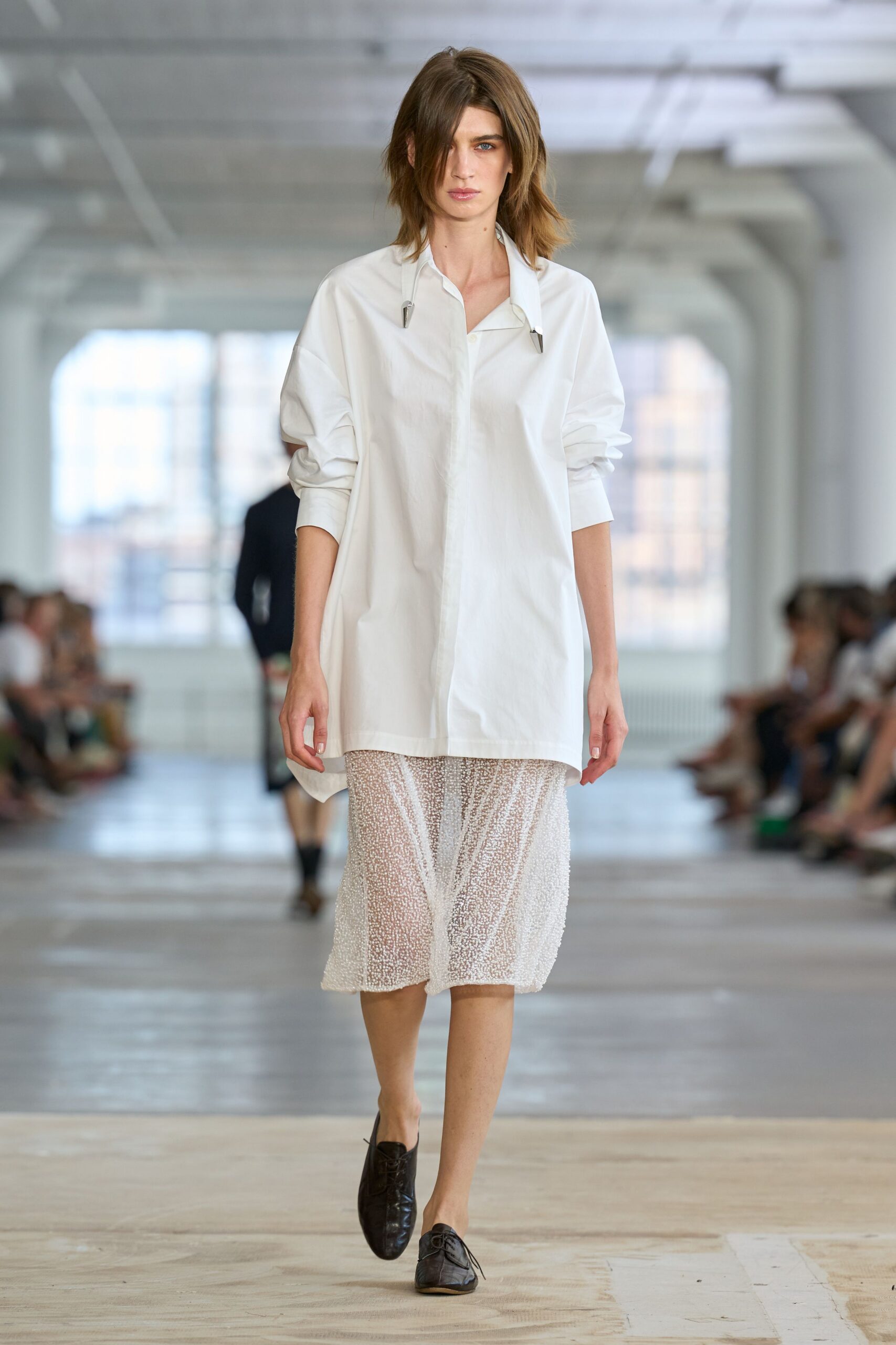 white cotton long-sleeve collared oversized buttoned shirt