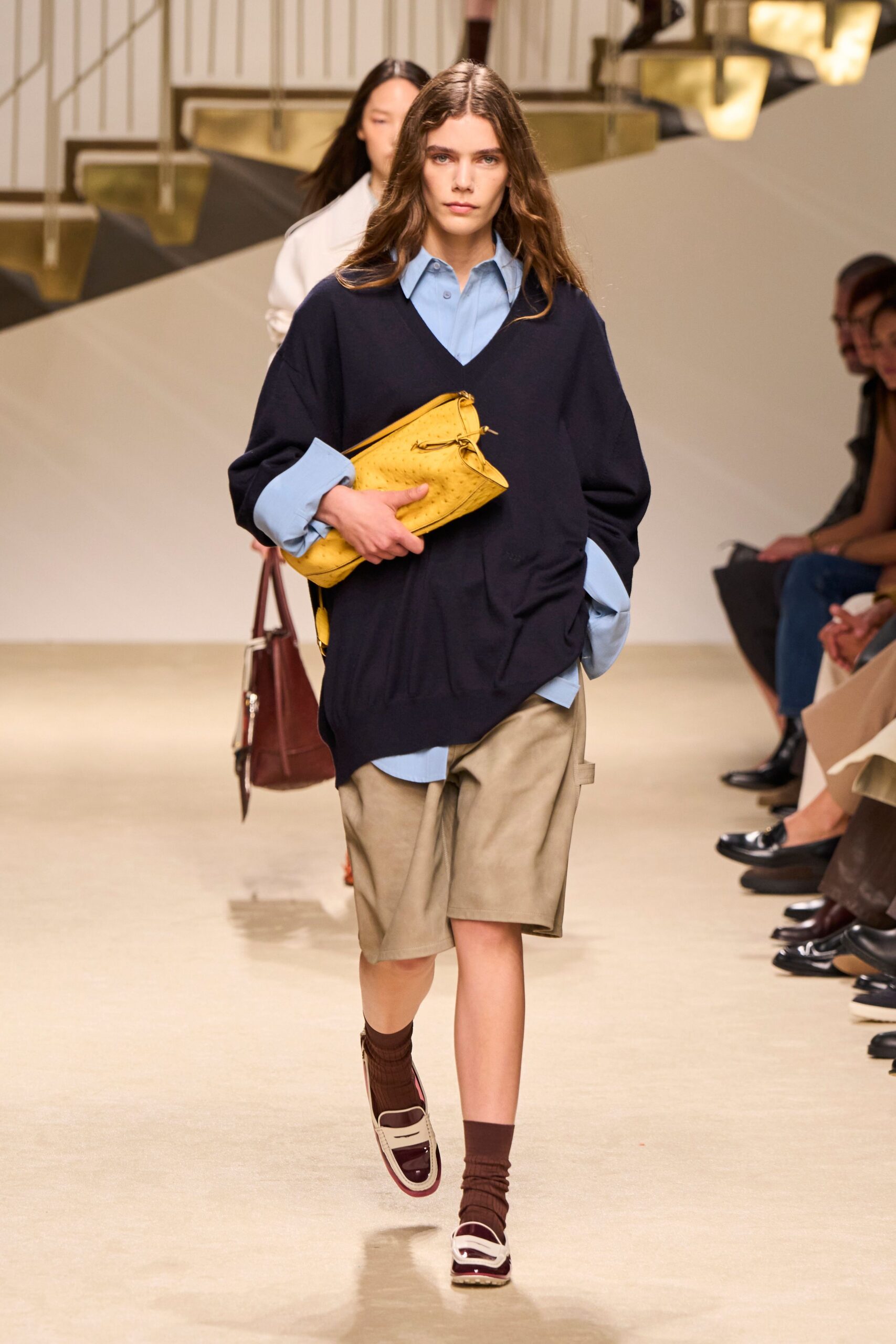 oversized V-neck sweater over shirt