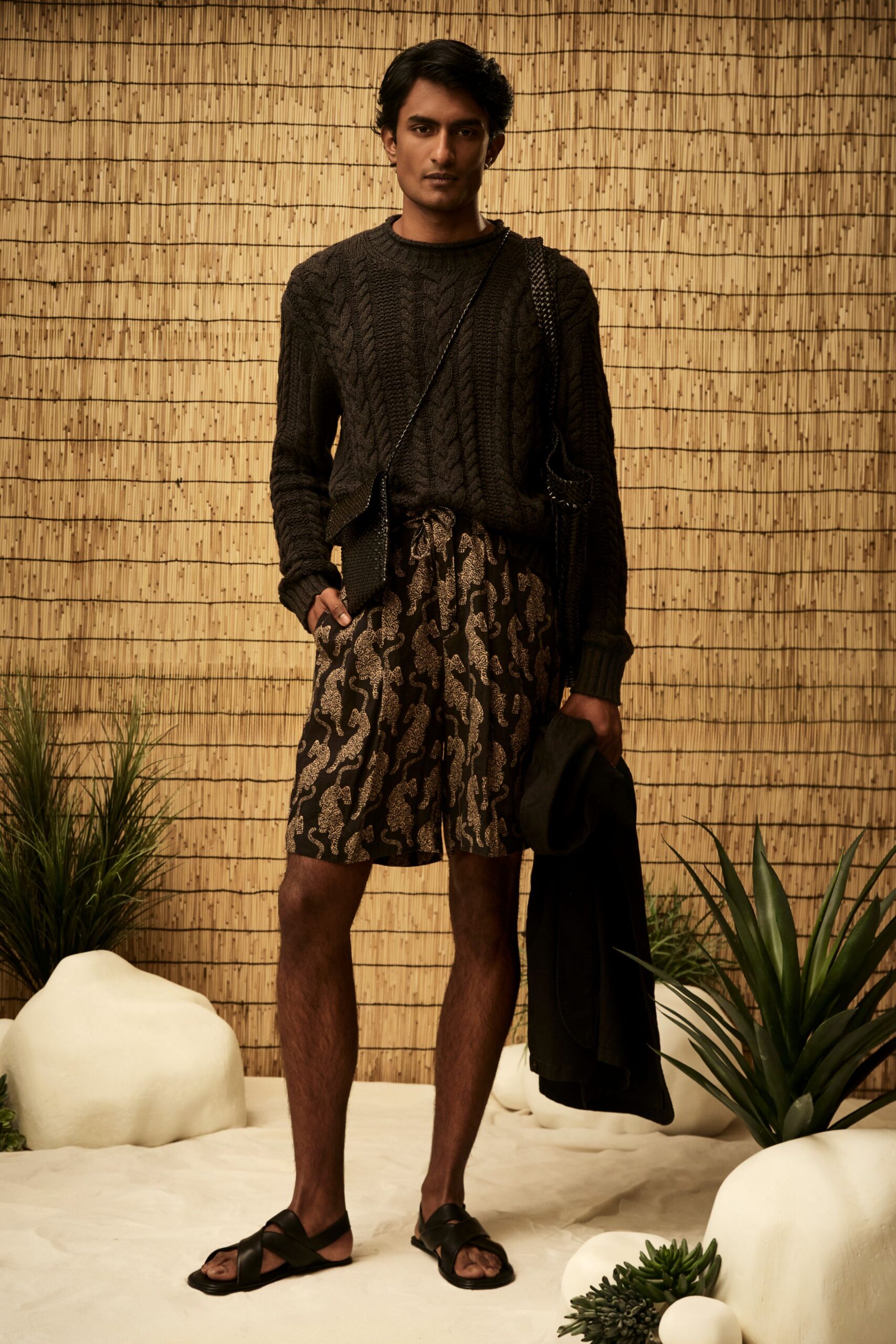 black cable-knit sweater