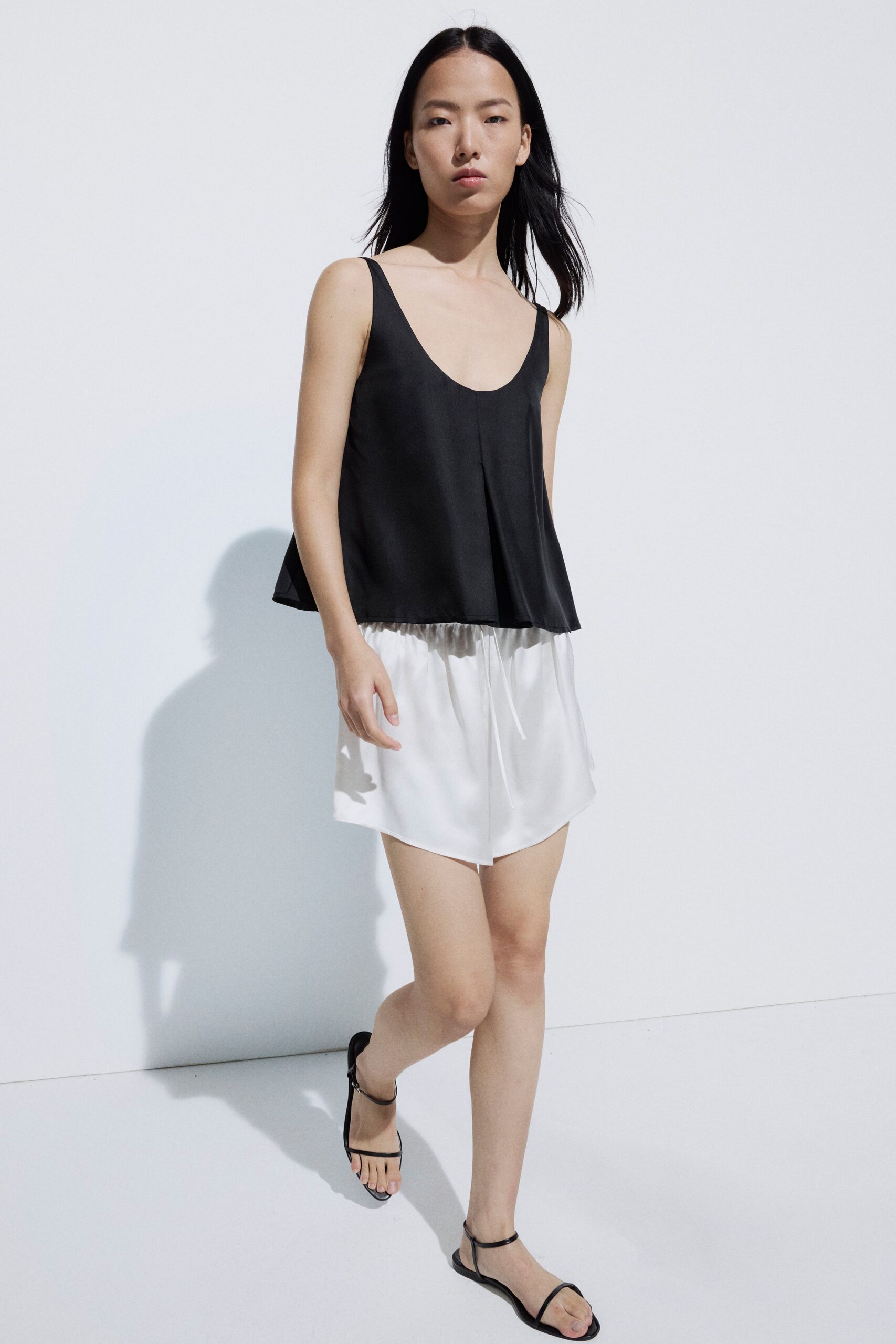 black satin sleeveless scoop-neck relaxed draped top