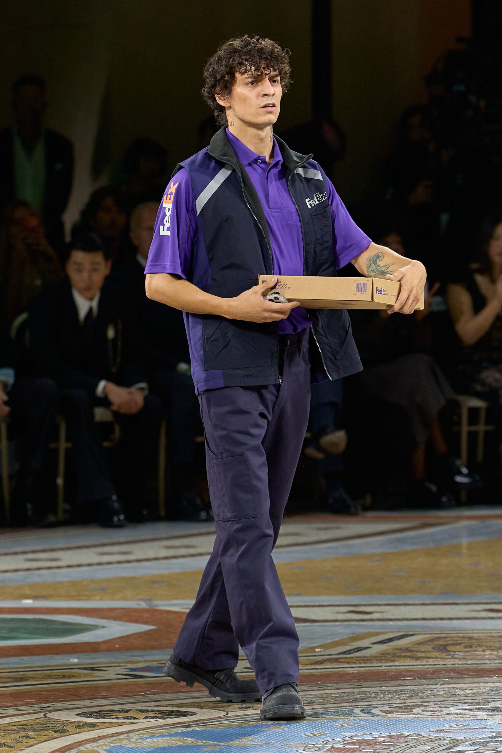 purple polo shirt with utility vest