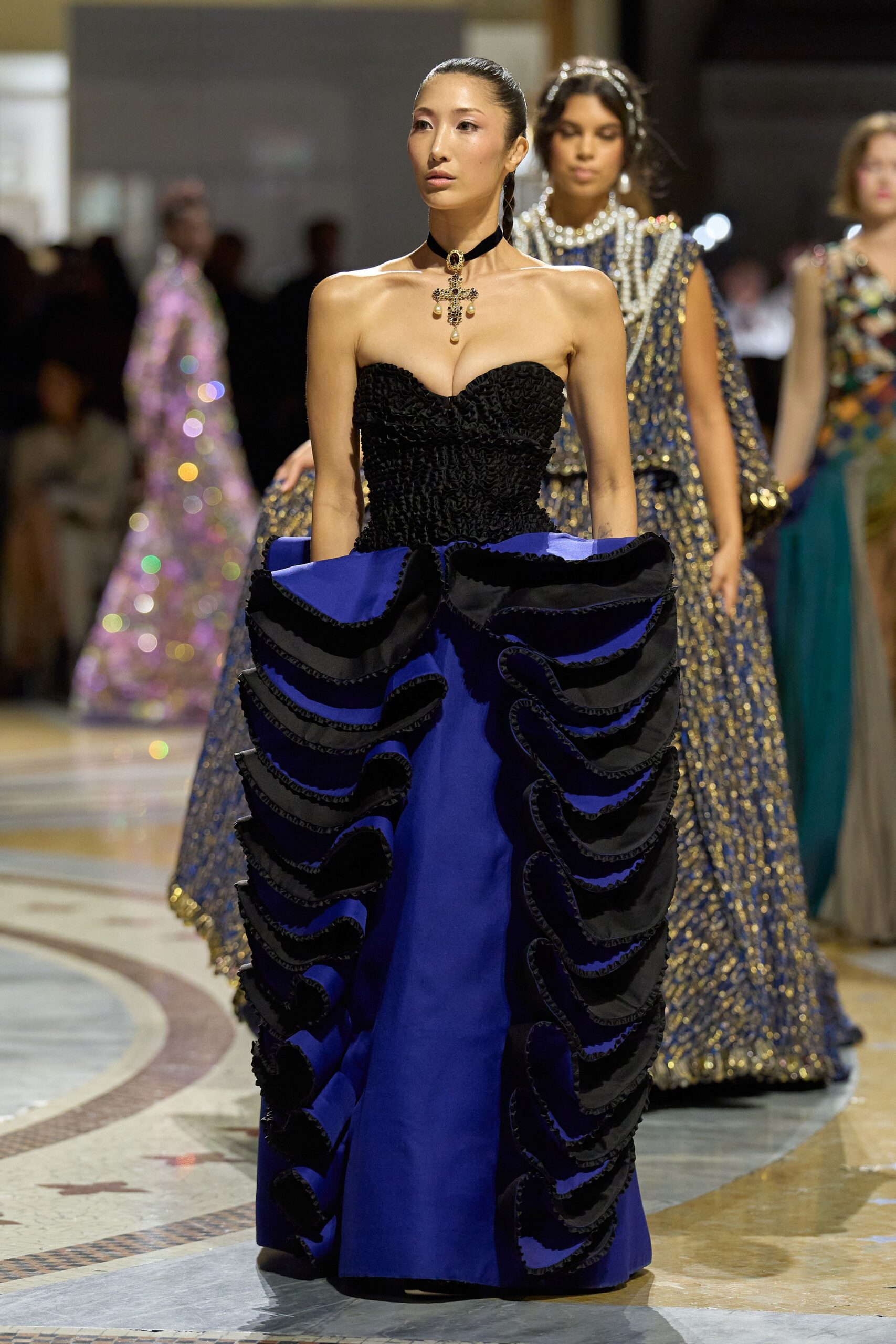 strapless ruffled blue and black ball gown