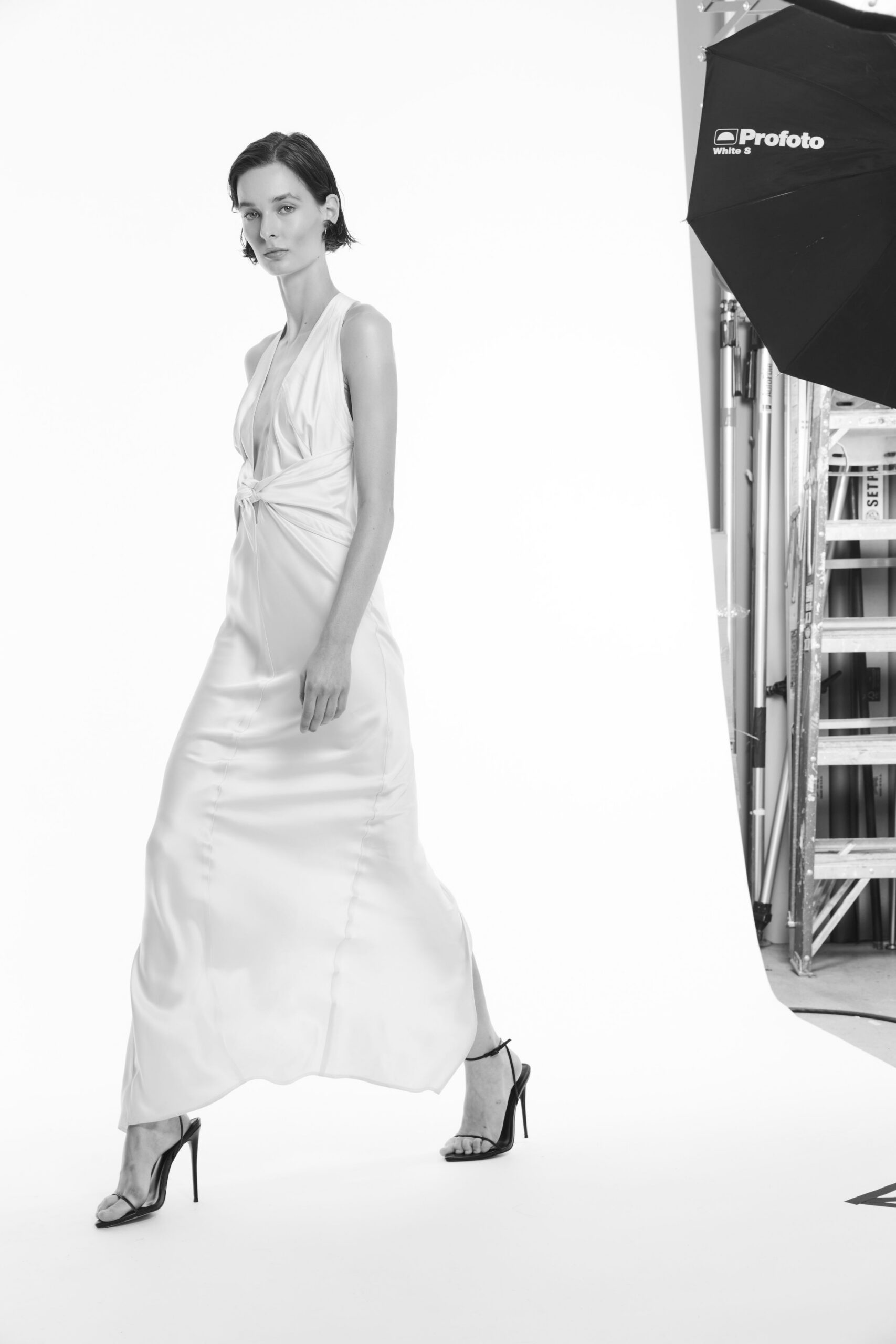 white satin twist-front halter gown