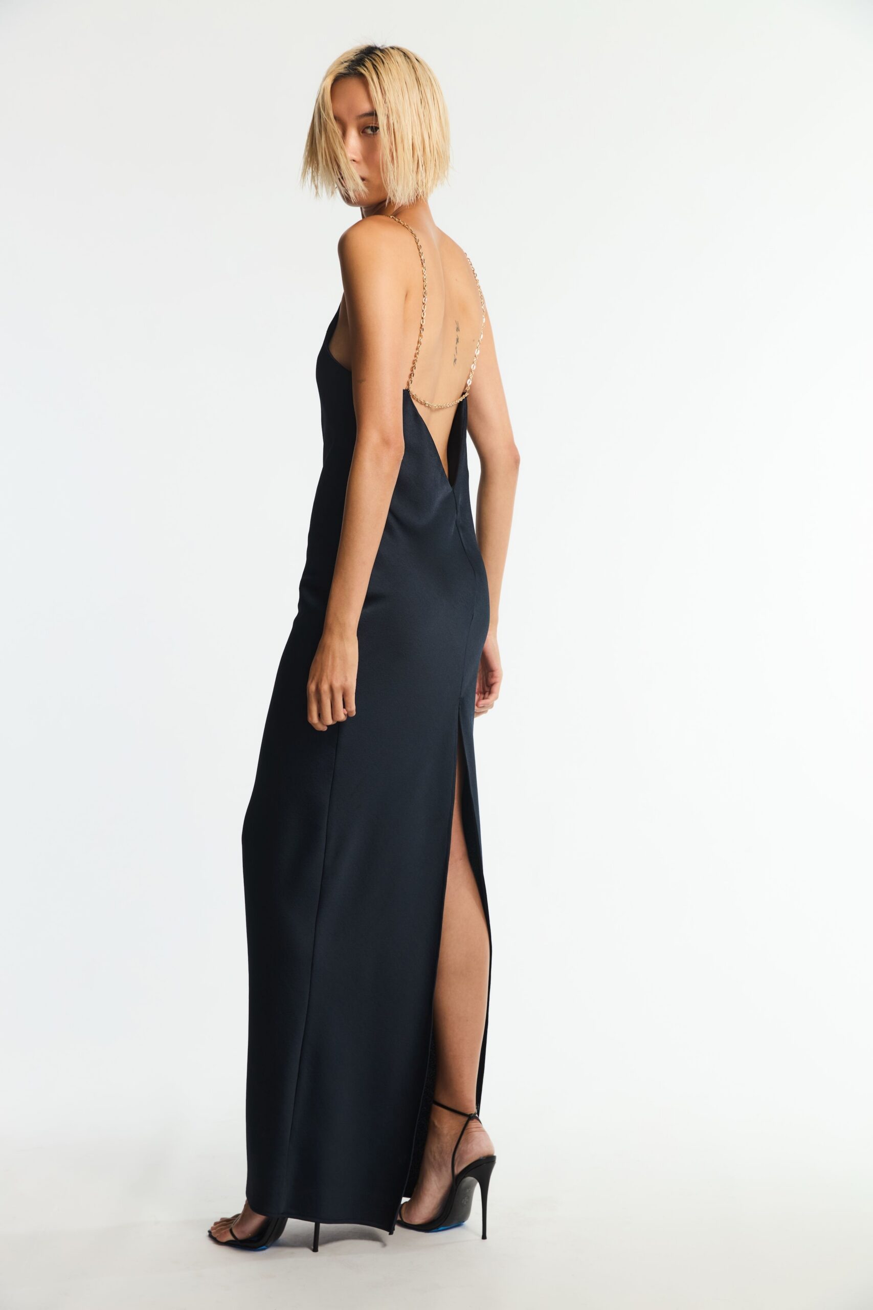 backless chain-strap black evening gown