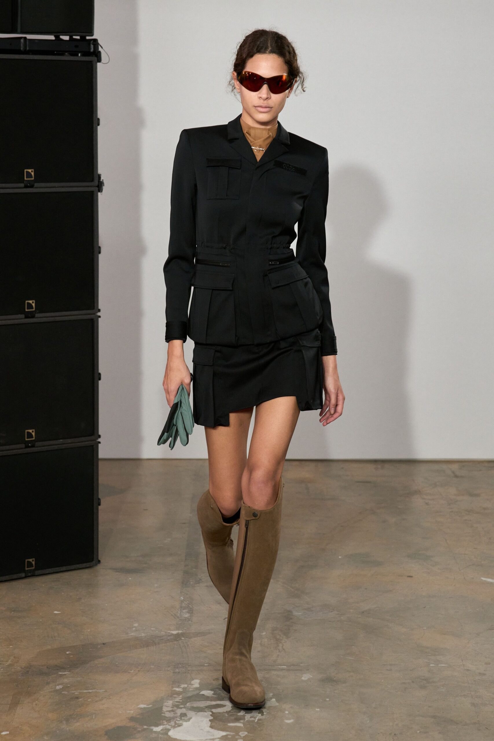 black utility jacket and mini skirt