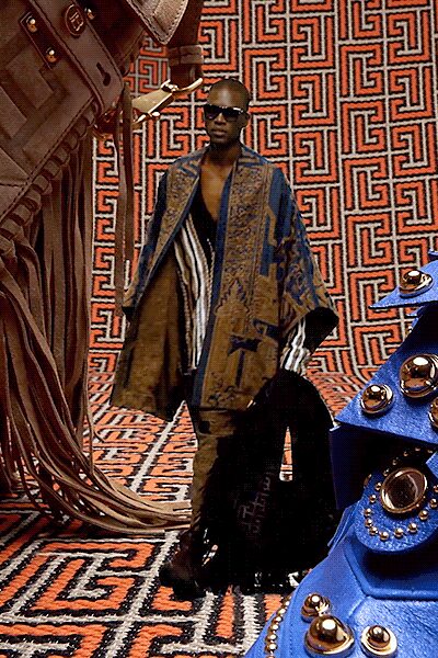 blue silk cape with black pants