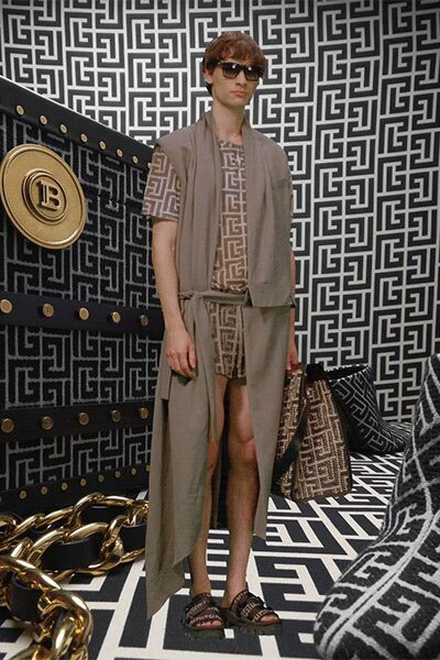 beige cape and jumpsuit ensemble
