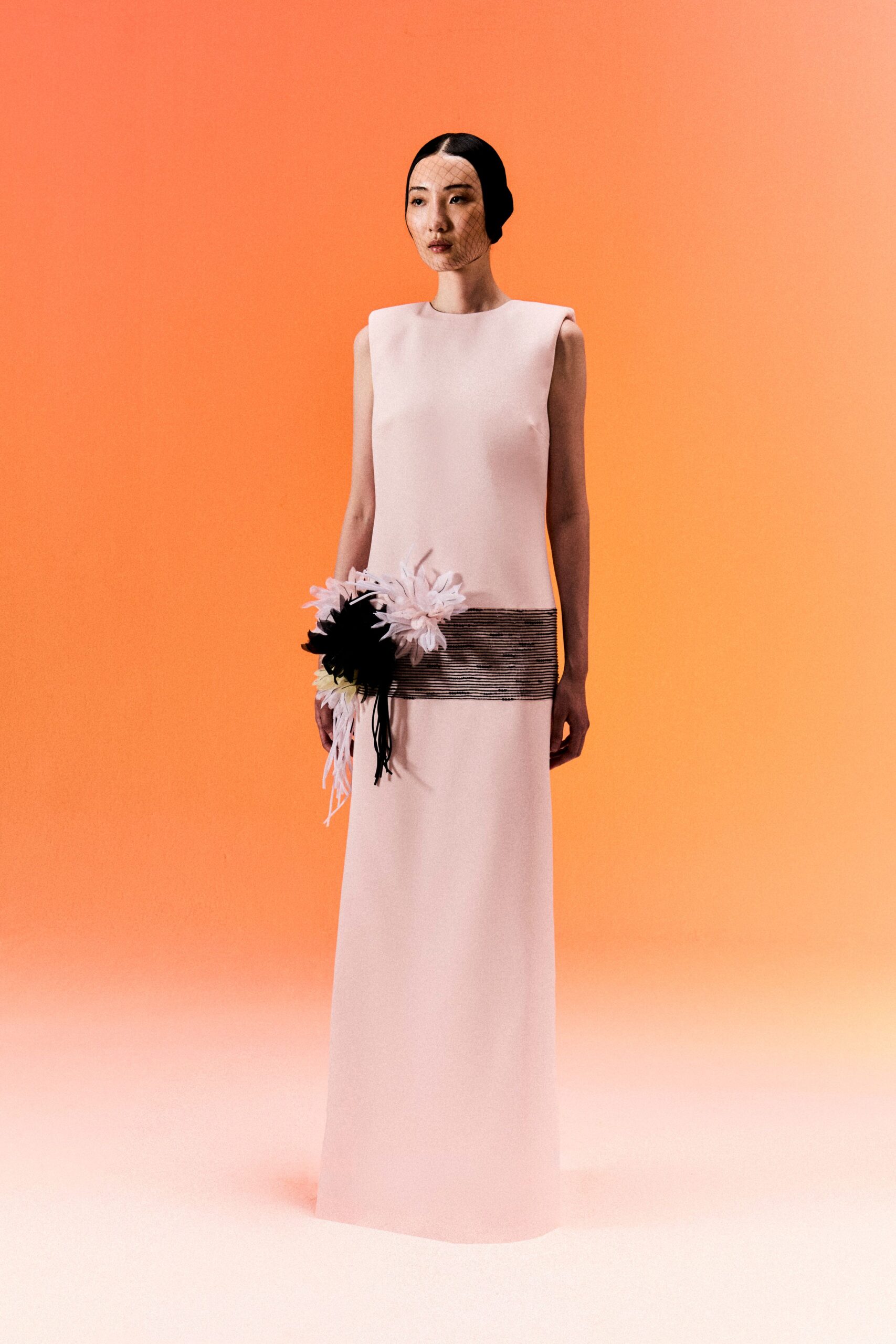 pink column gown with floral appliqué