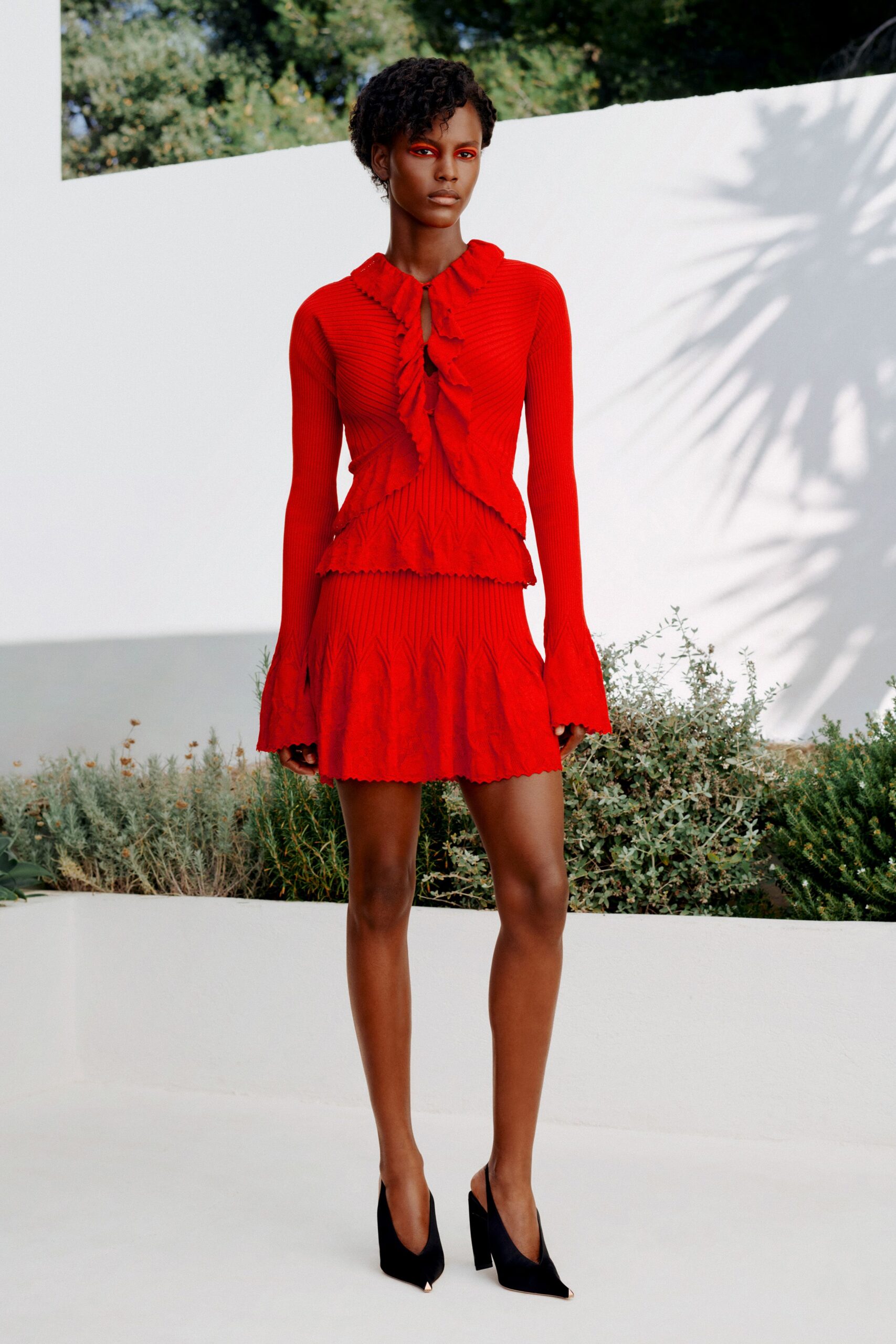 red ruffle-front knit sweater