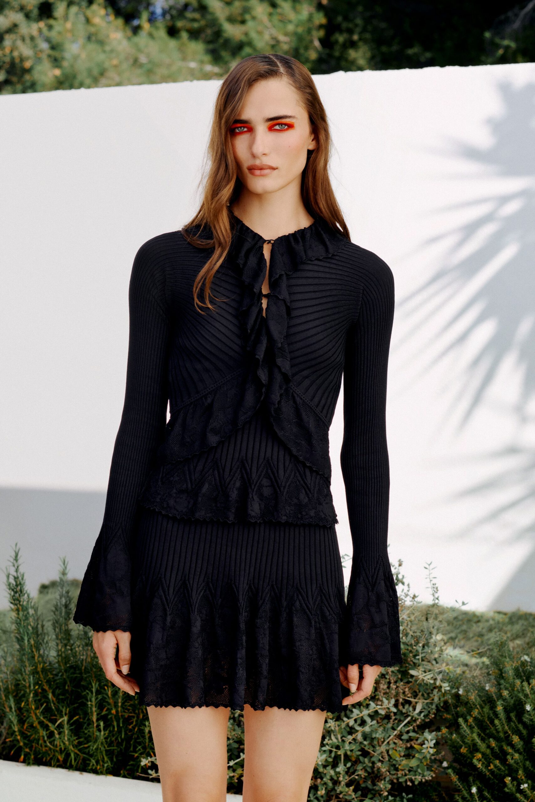 black ruffle-front knit mini dress