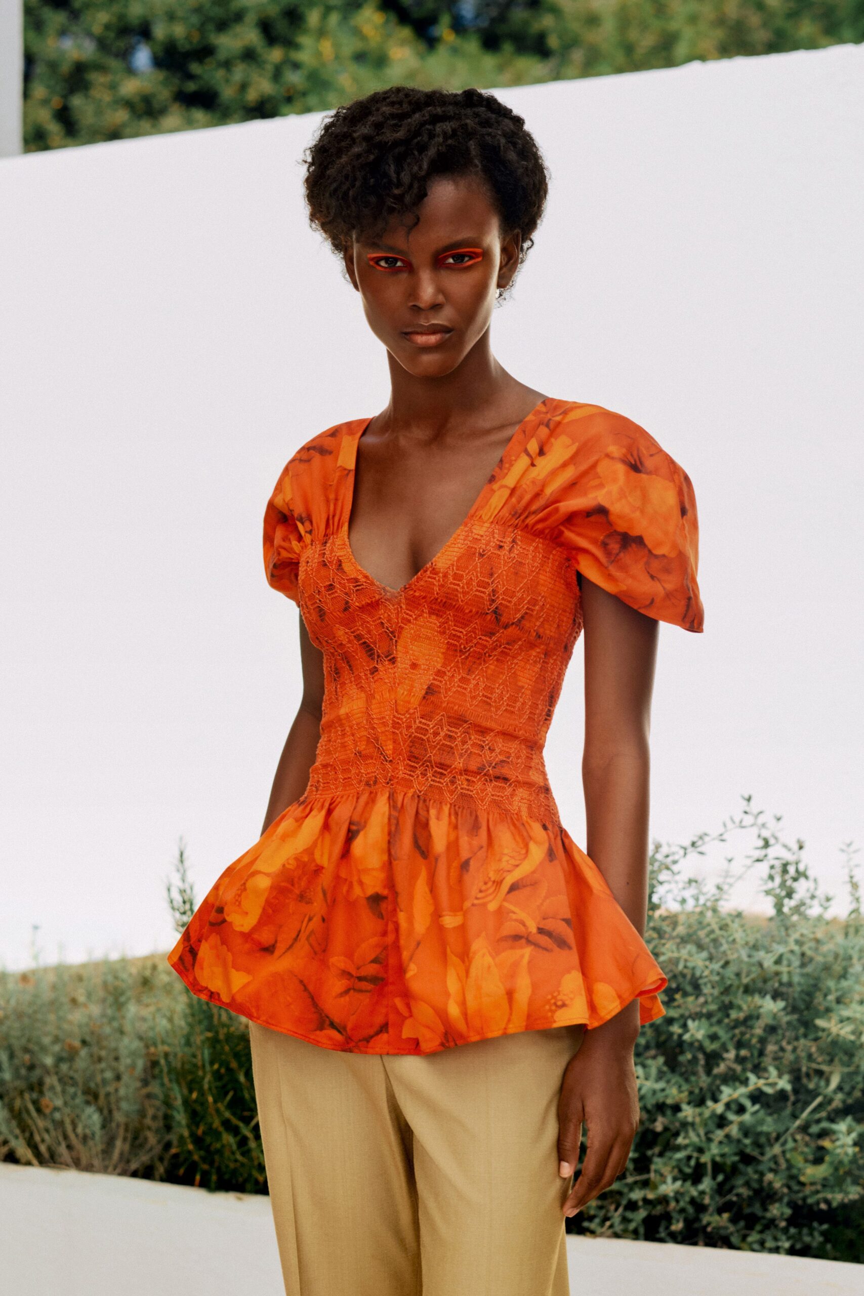orange floral smocked peplum blouse