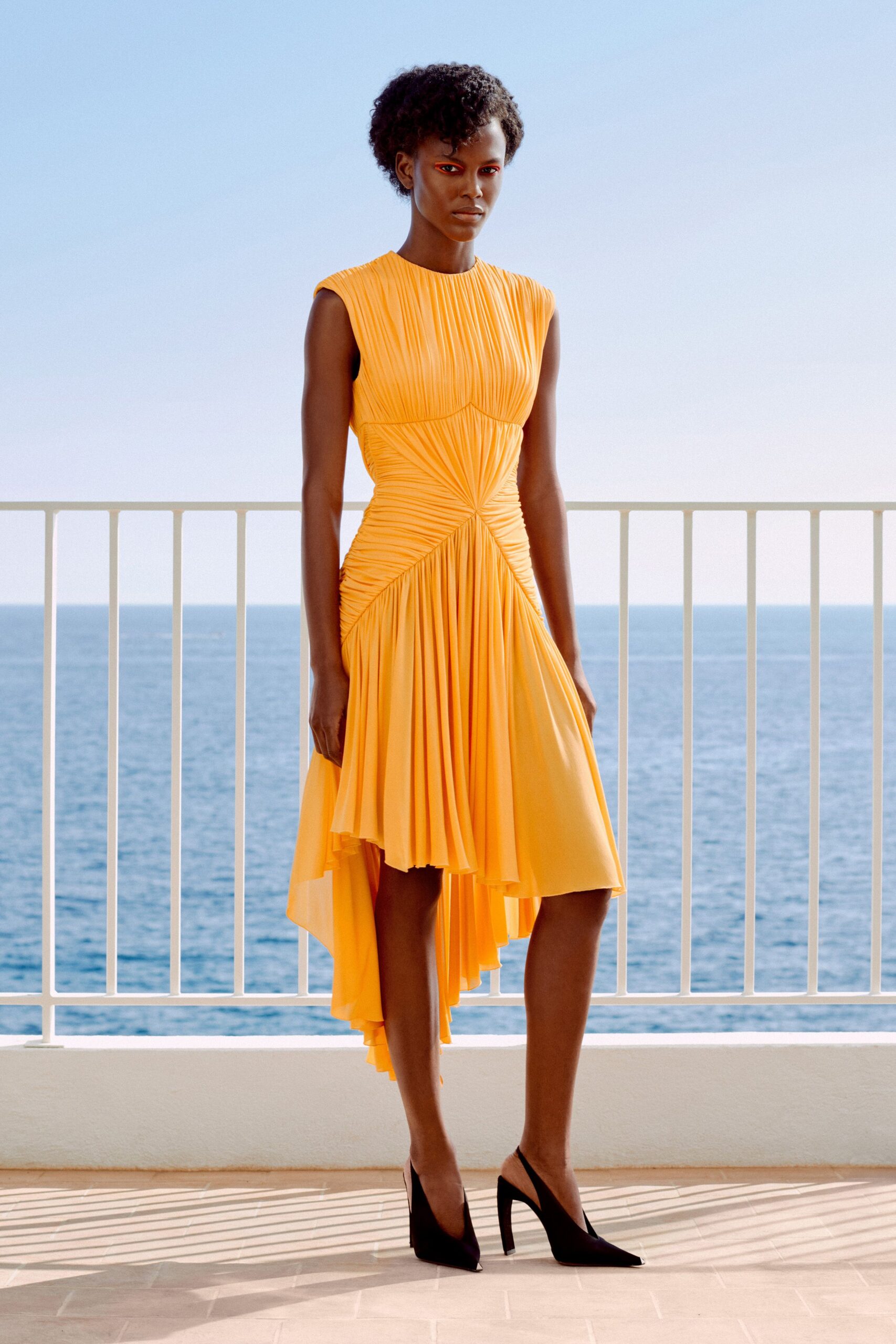 orange pleated handkerchief hem dress