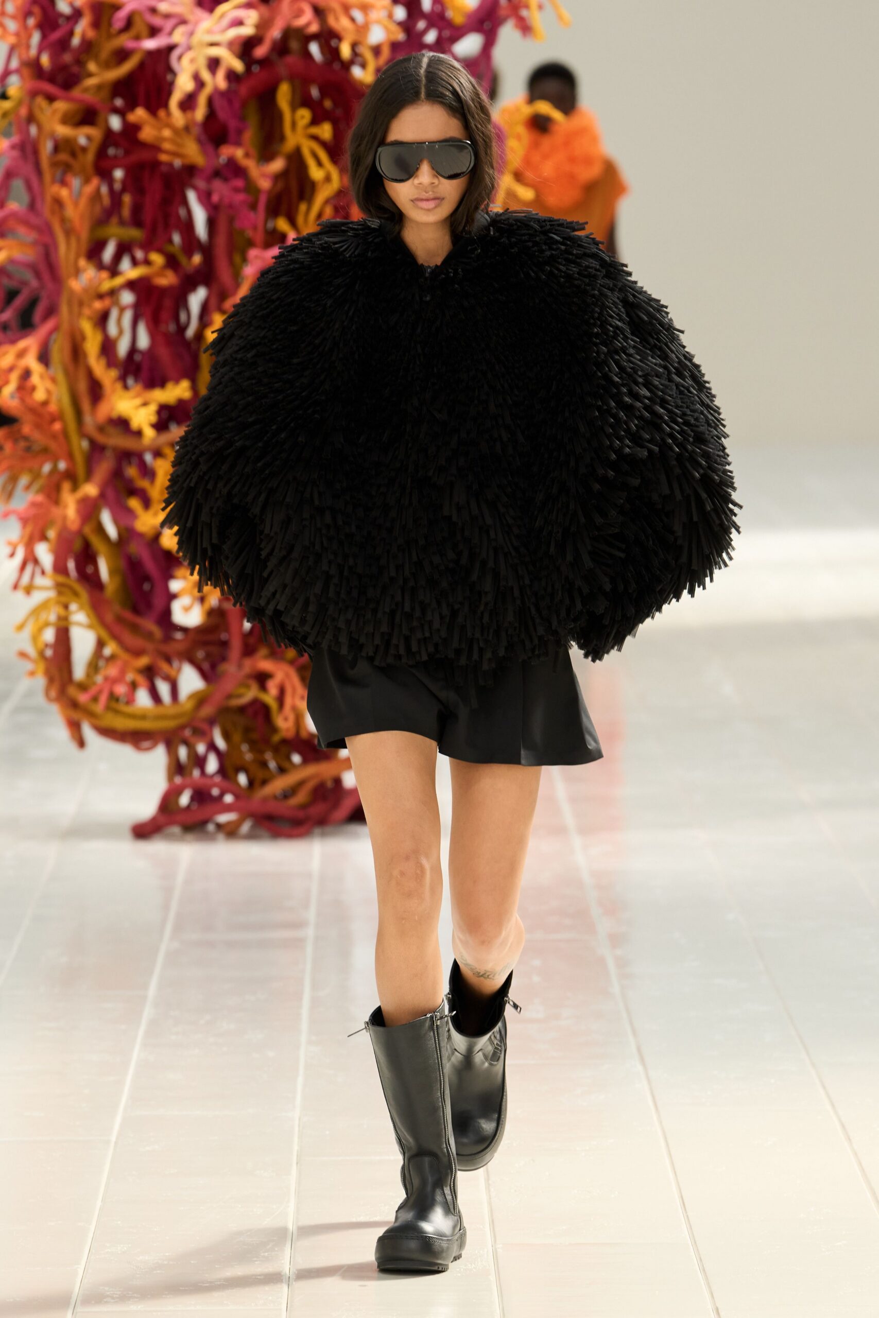 black fringed cape