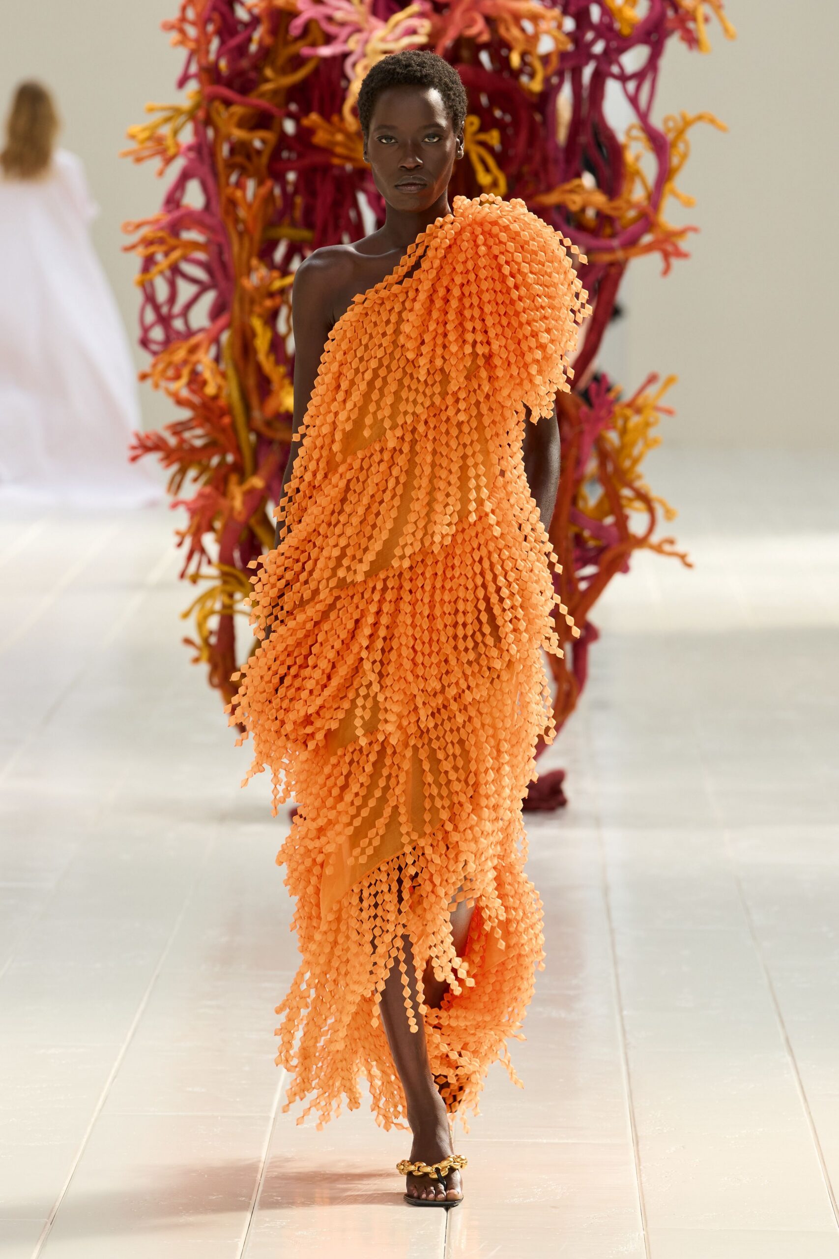 orange one-shoulder fringe evening gown