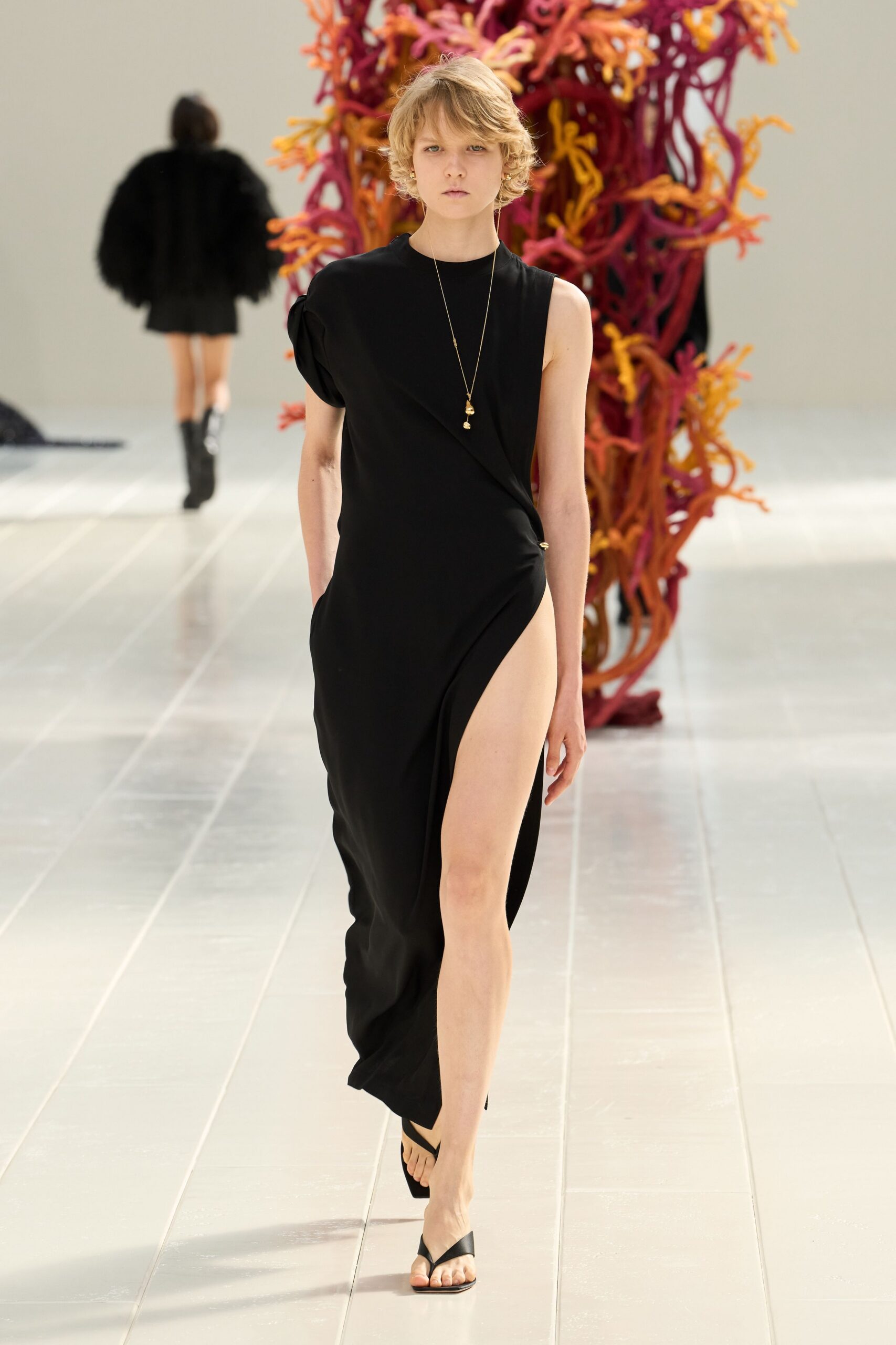 black draped high-slit evening gown