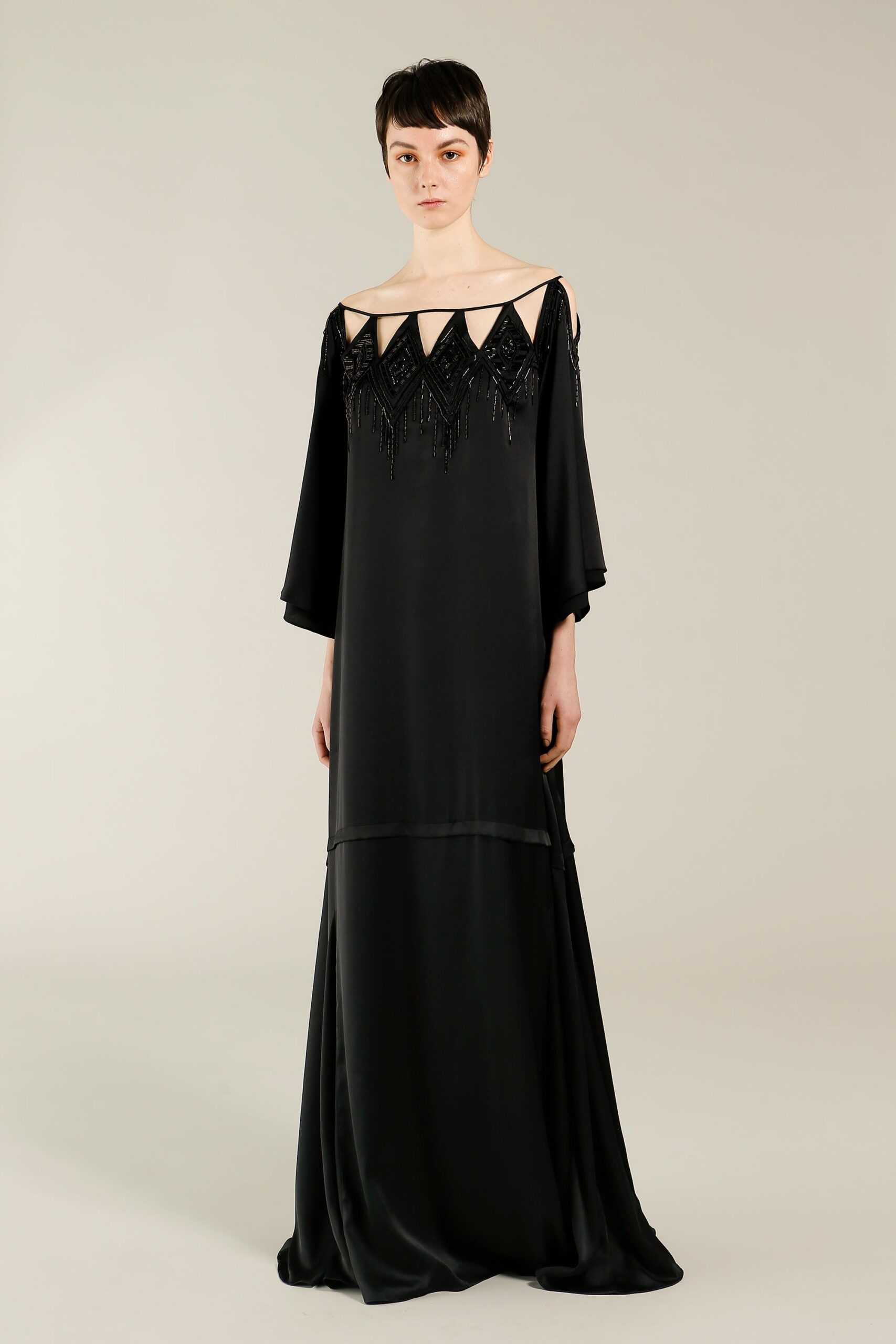 black beaded cold-shoulder evening gown