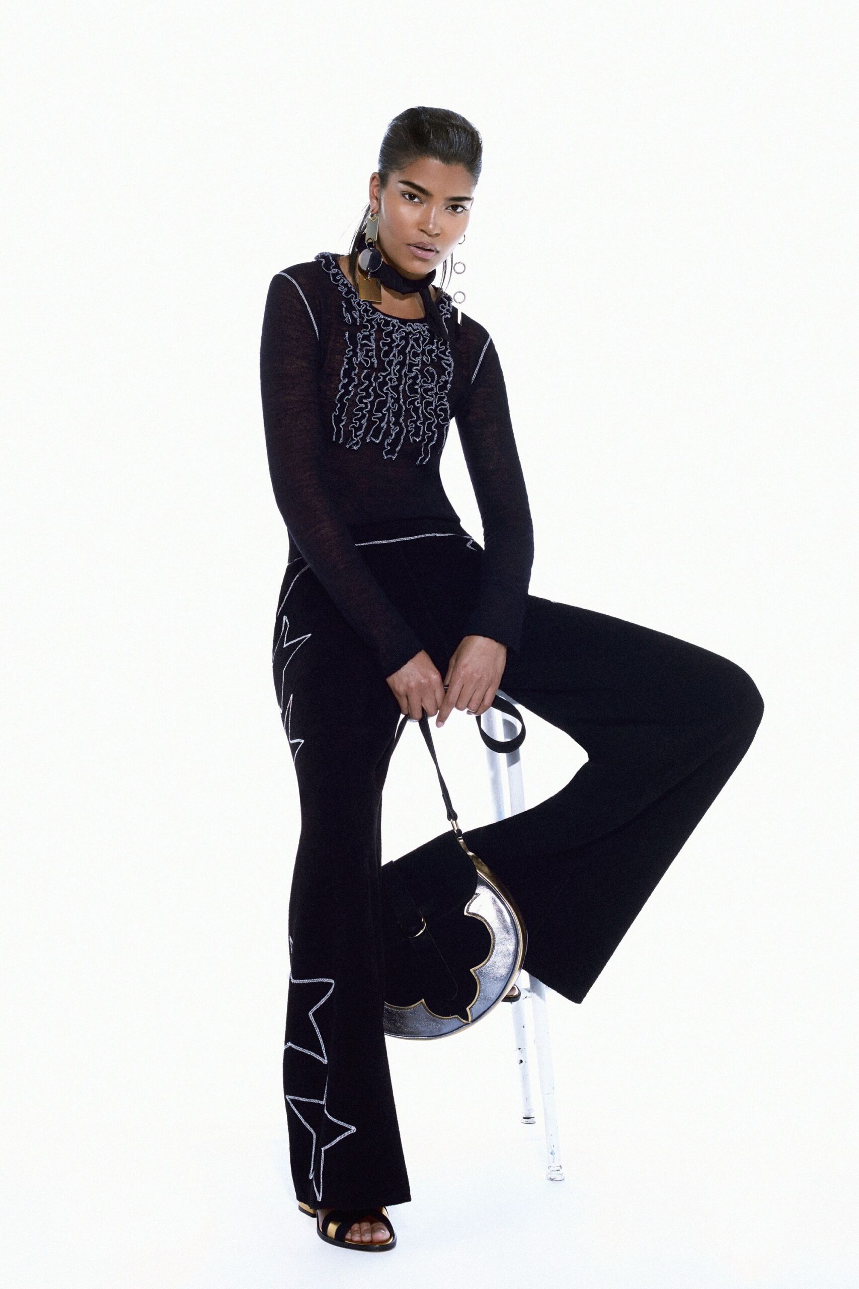 black knit flared jumpsuit with star motif