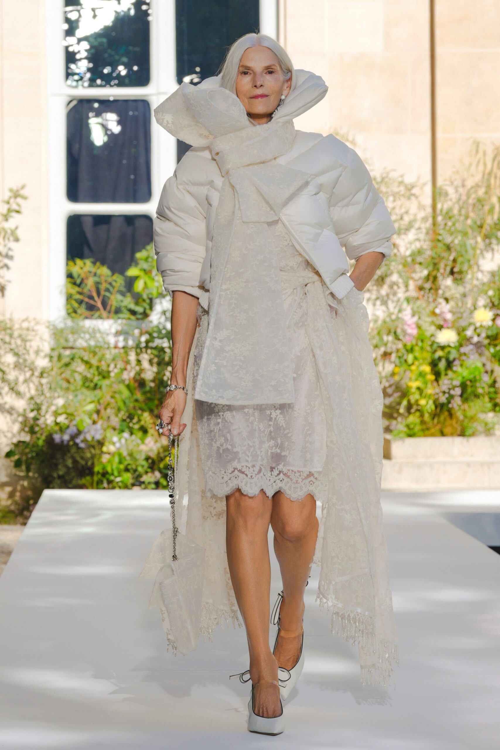 white lace dress with puffer jacket