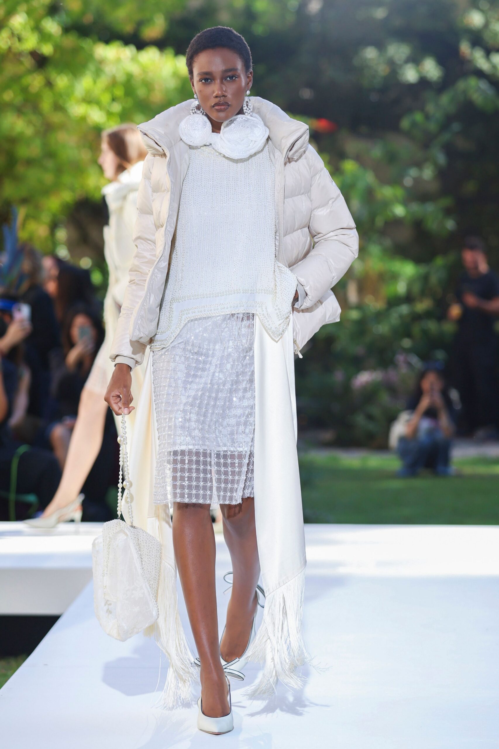 ivory puffer jacket over sheer beaded skirt