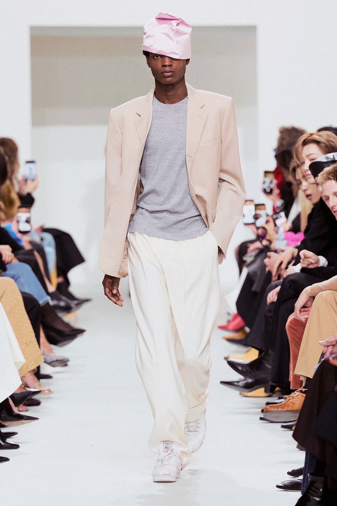 pink satin hat with tailored blazer