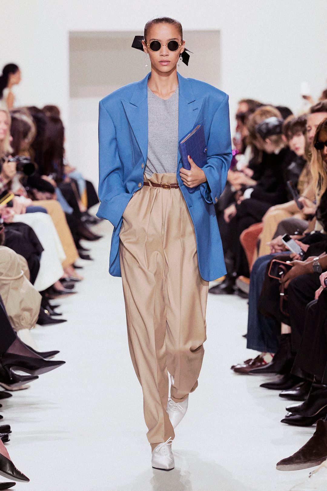 beige high-waisted pleated belted flowing pants