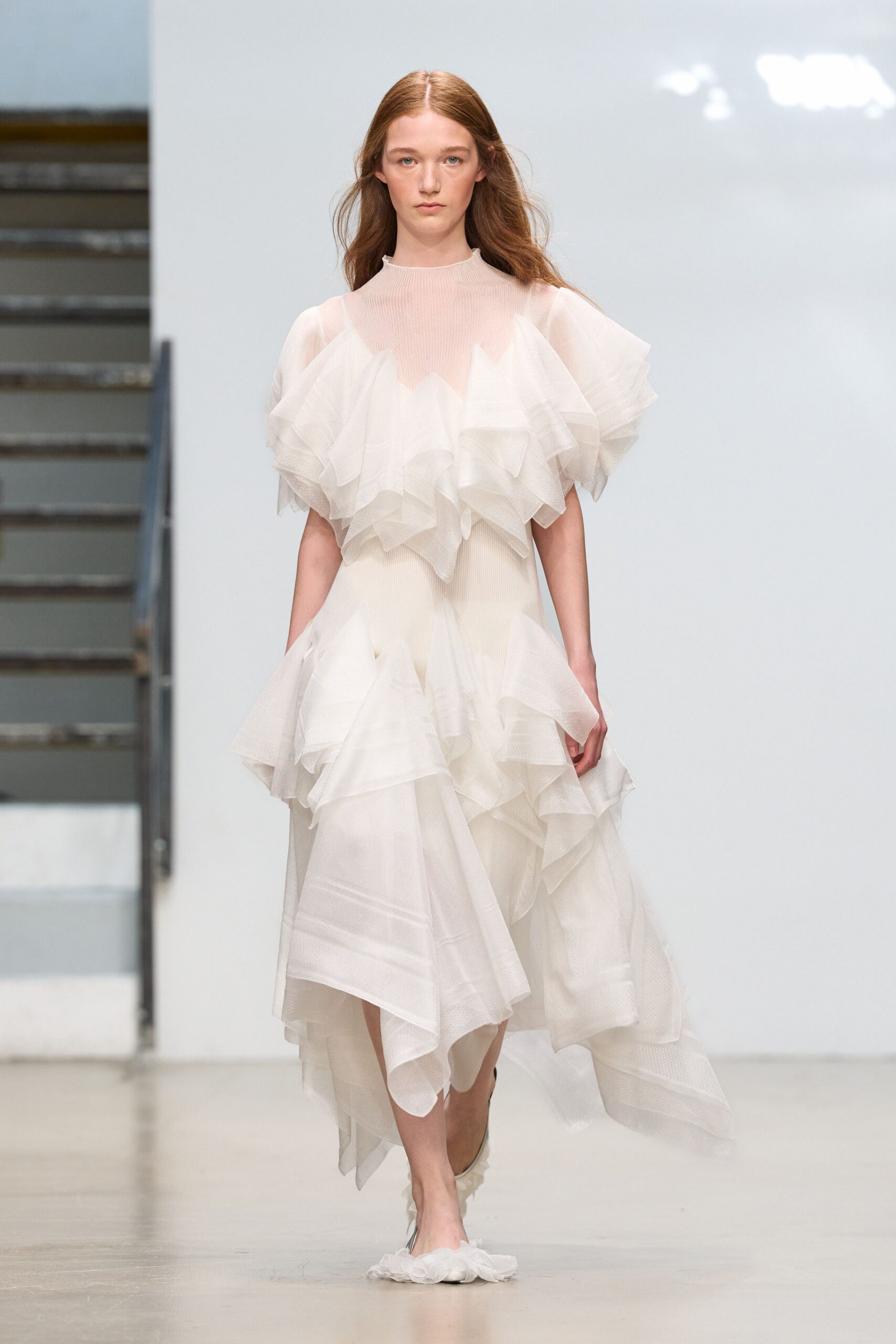 ivory ruffled organza handkerchief-hem gown
