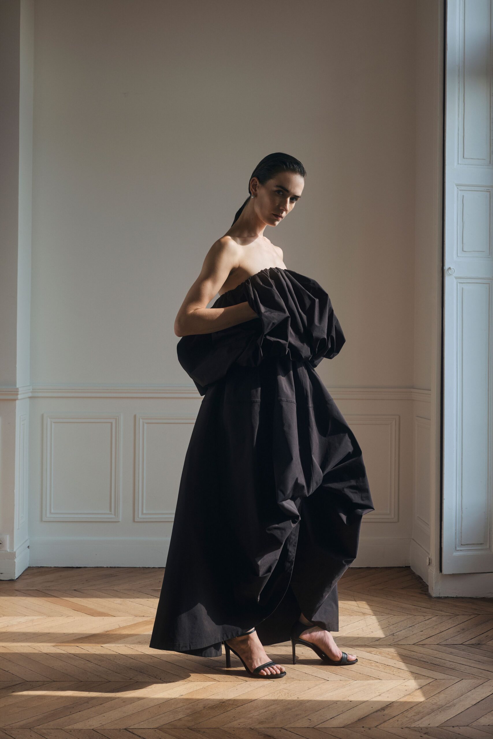 strapless sculptural black evening gown