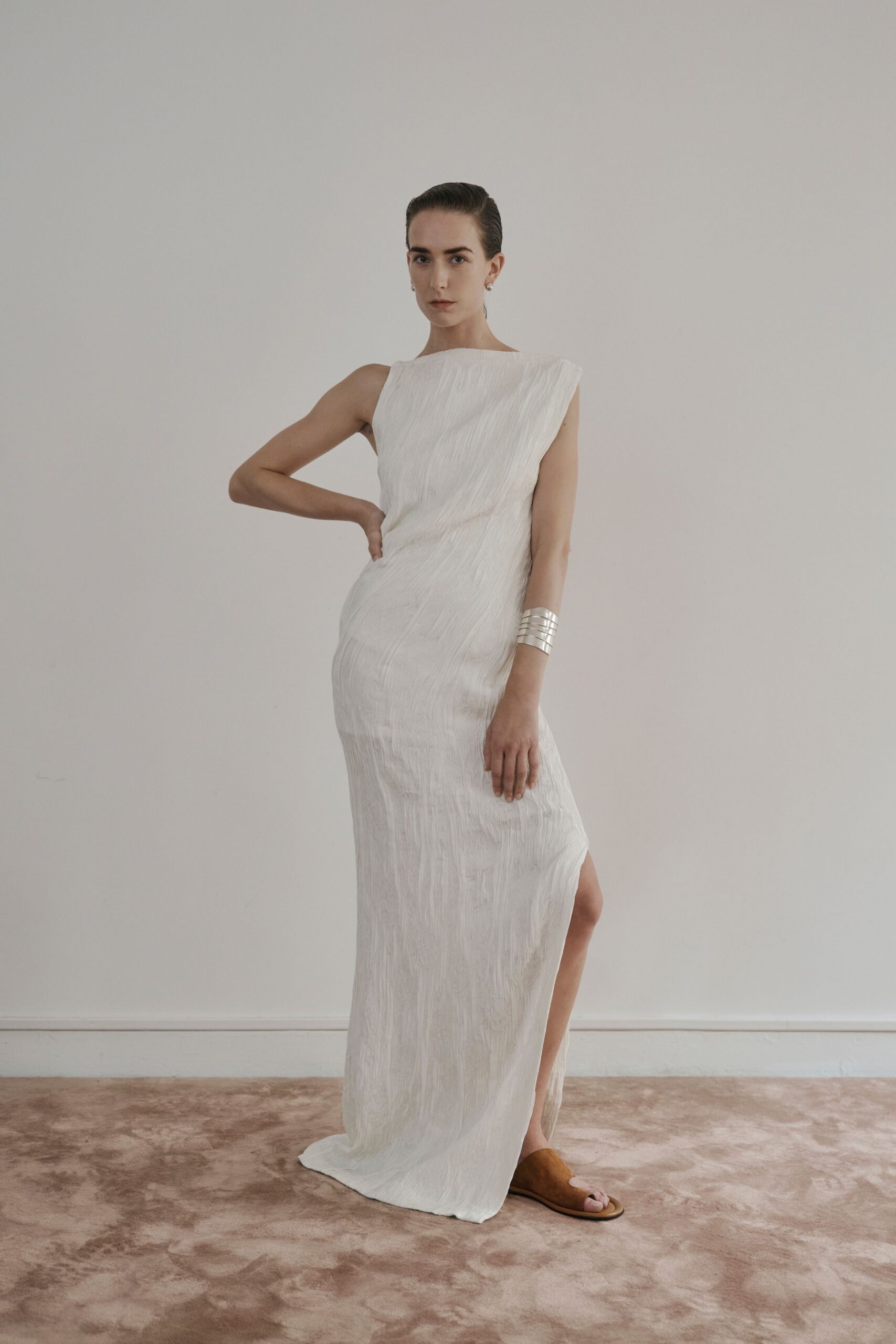 white textured boat-neck evening gown