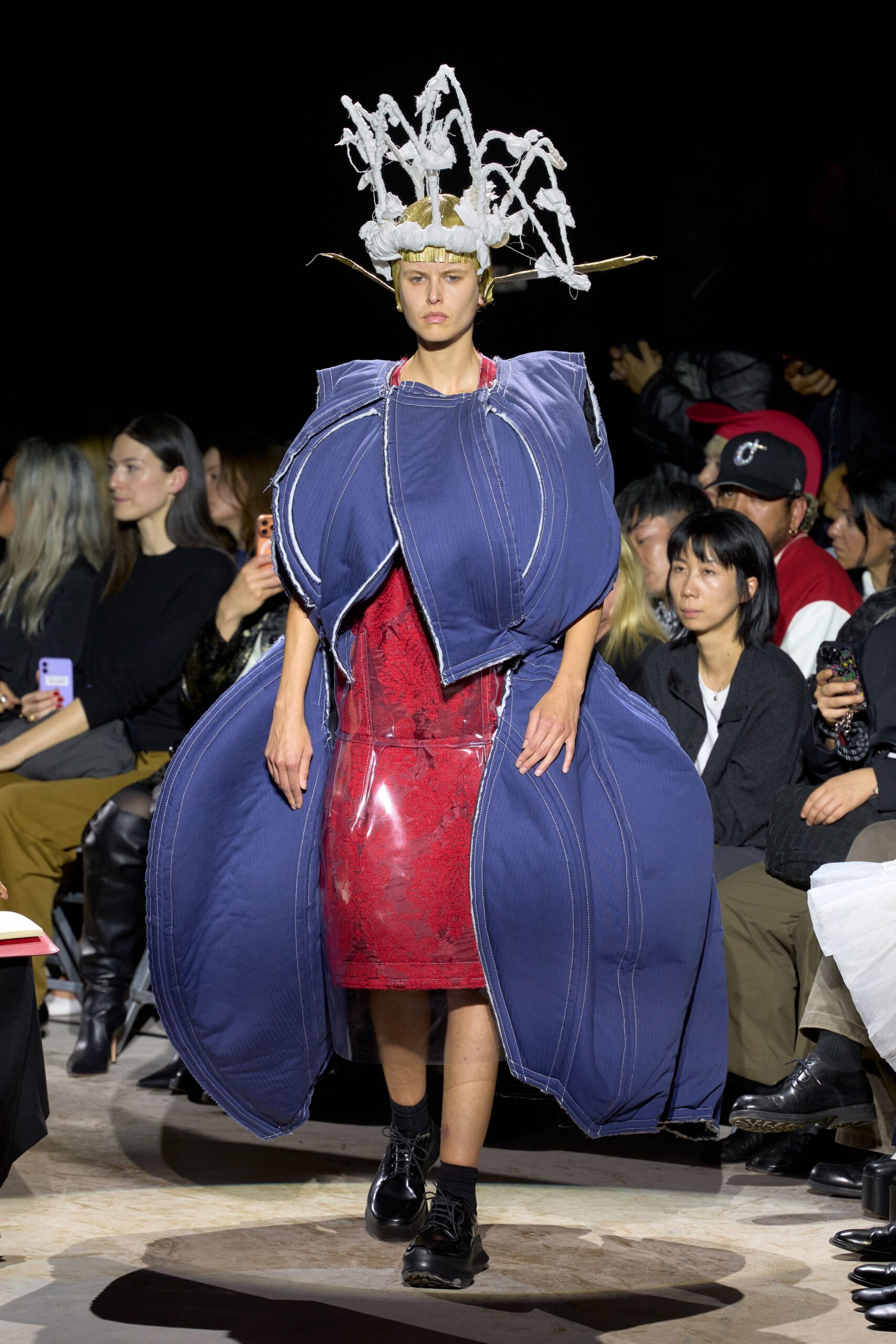 sculptural cocoon coat over lace dress