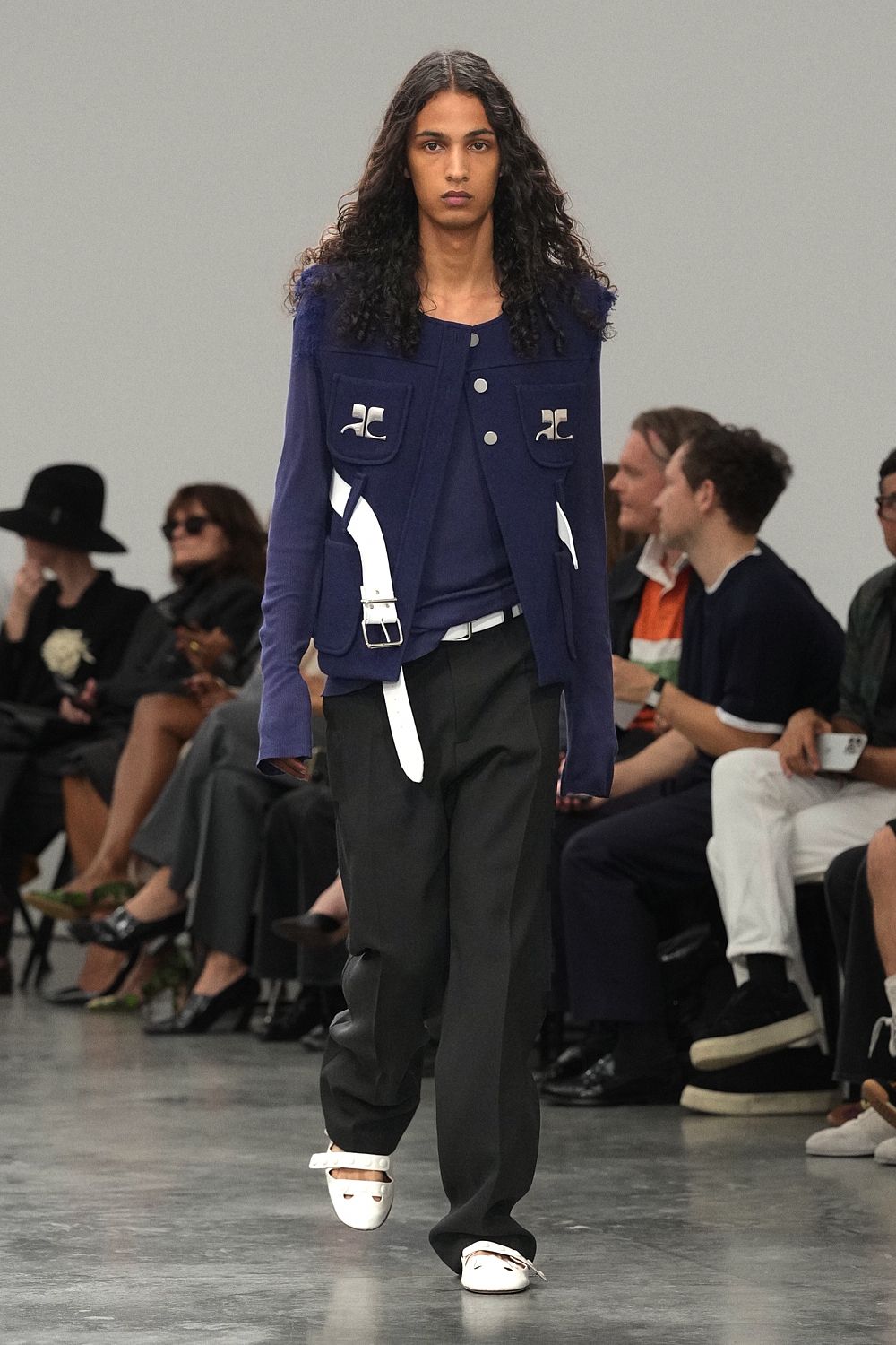 blue utility jacket with white straps