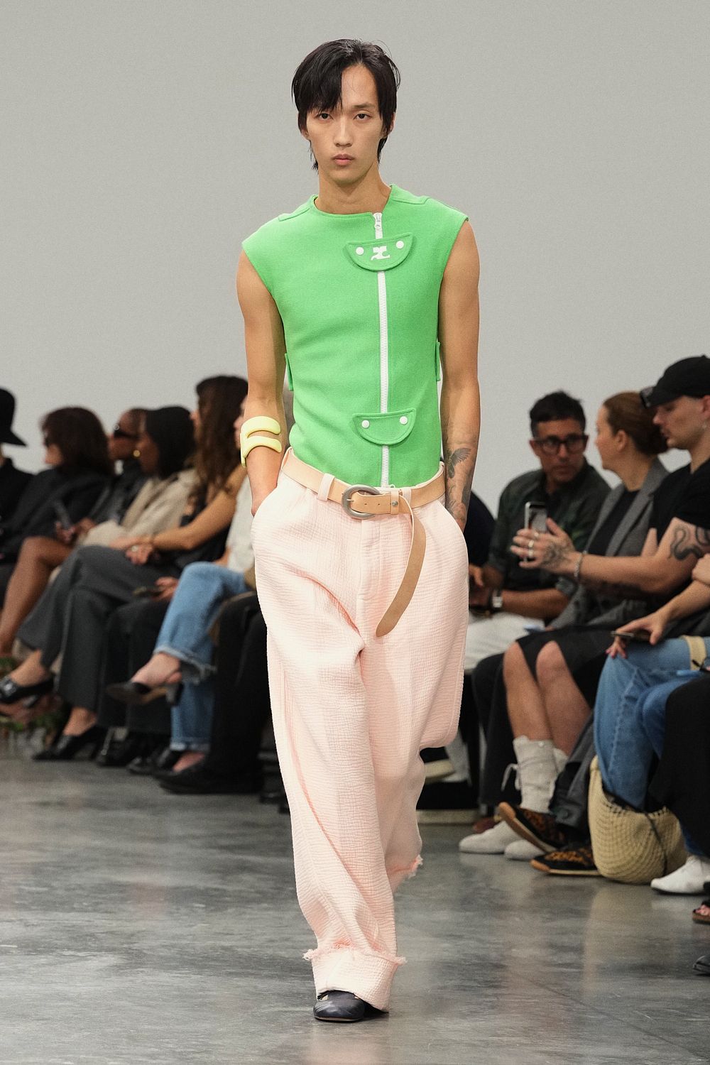 green sleeveless zip-front knit top