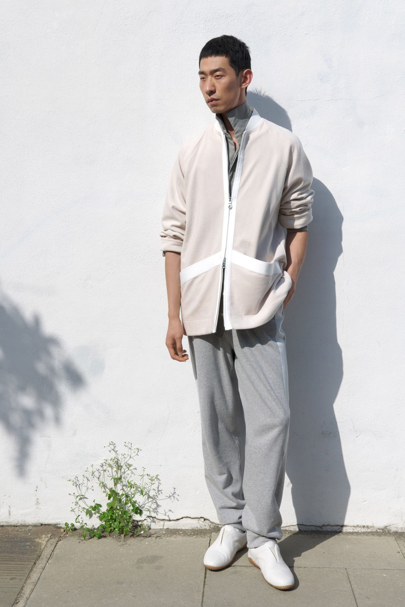 ivory jersey long-sleeve high-neck relaxed zippered panelled jacket