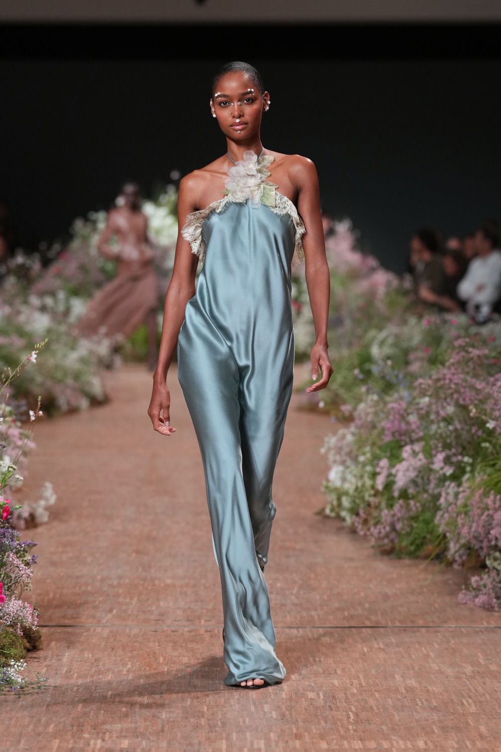 blue satin halter jumpsuit with floral appliqué