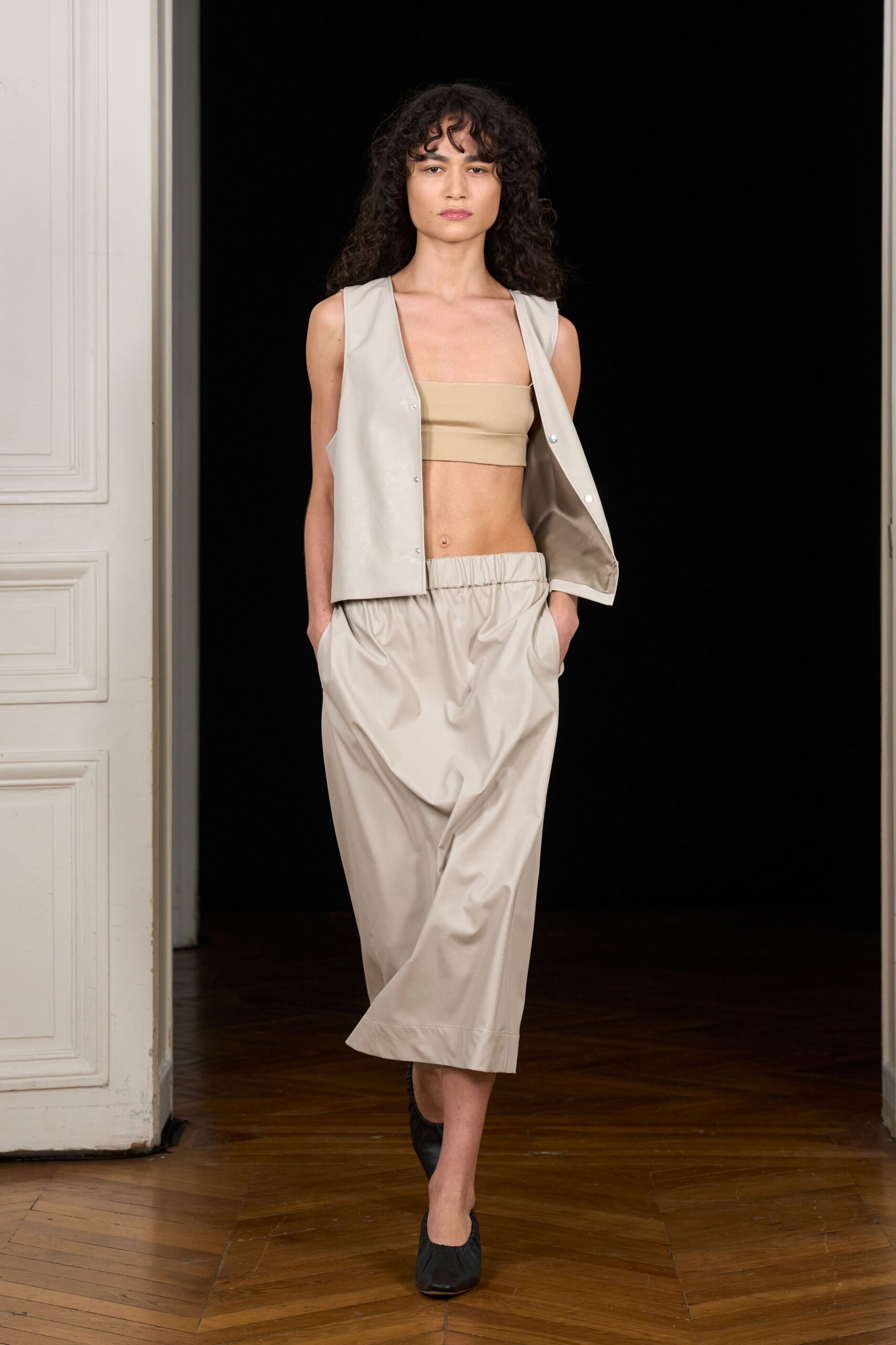 beige bandeau top and draped skirt