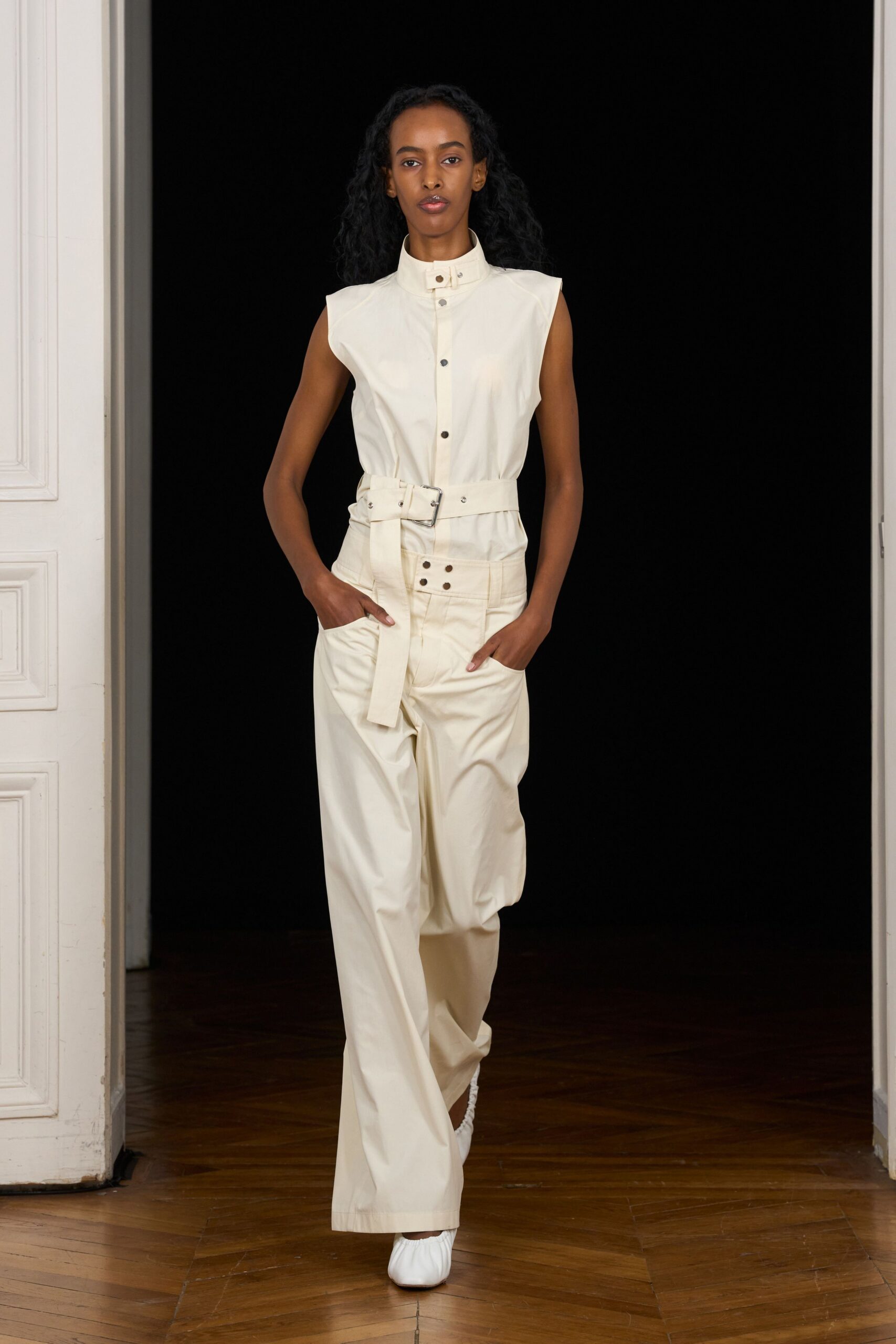 ivory sleeveless high-neck relaxed belted buttoned jumpsuit