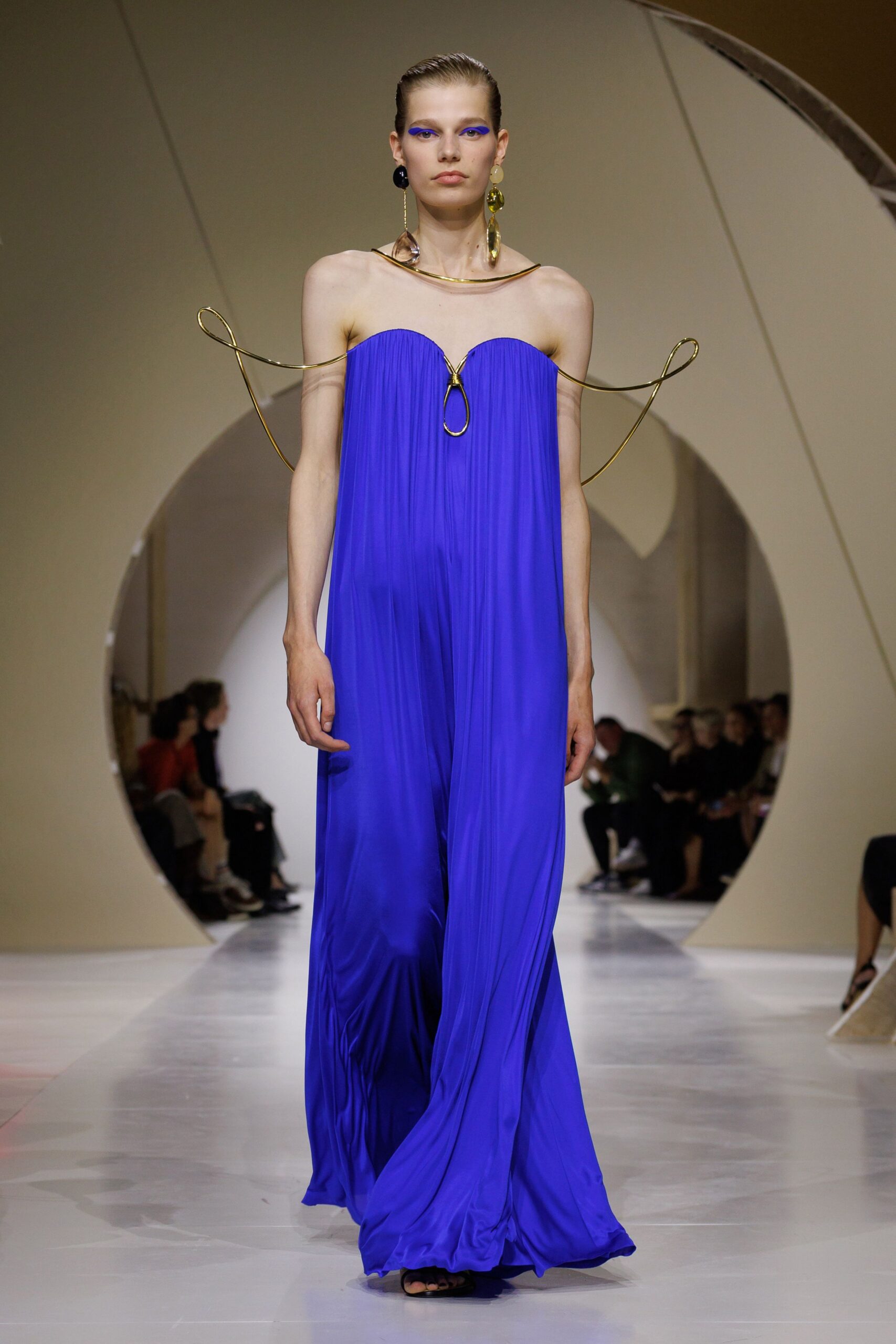 strapless pleated blue evening gown