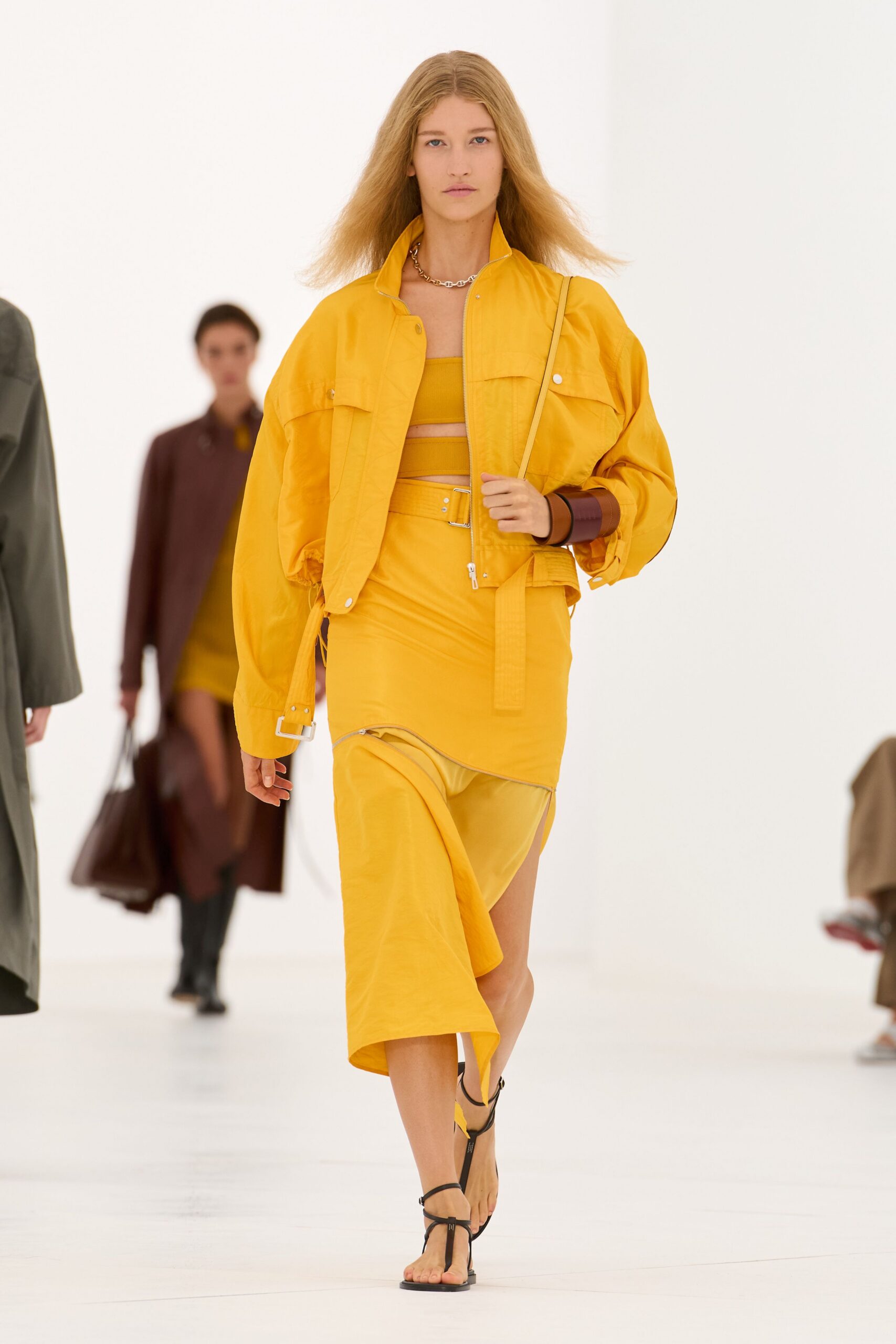 yellow utility jacket and sarong skirt