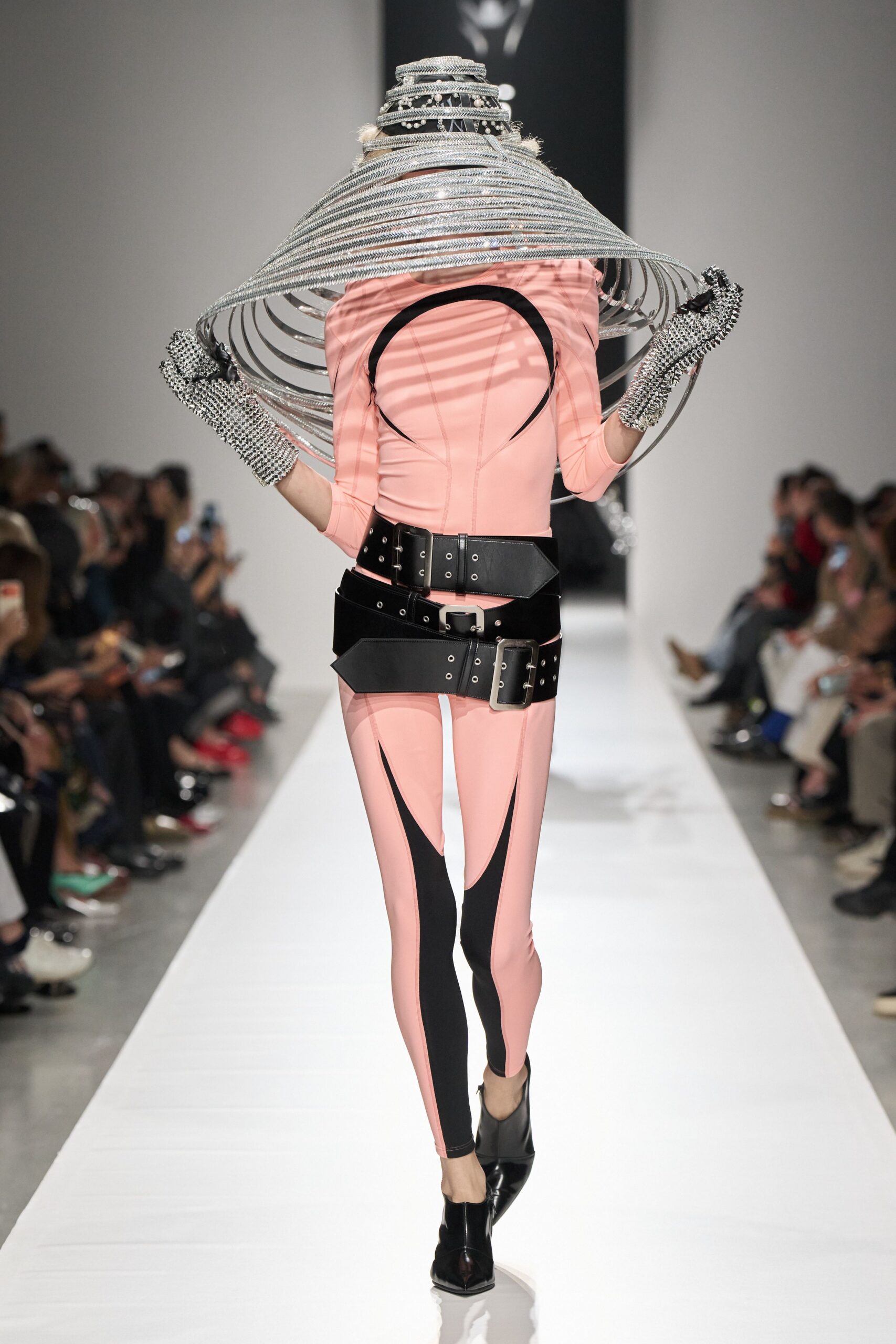pink cutout catsuit with stacked belts