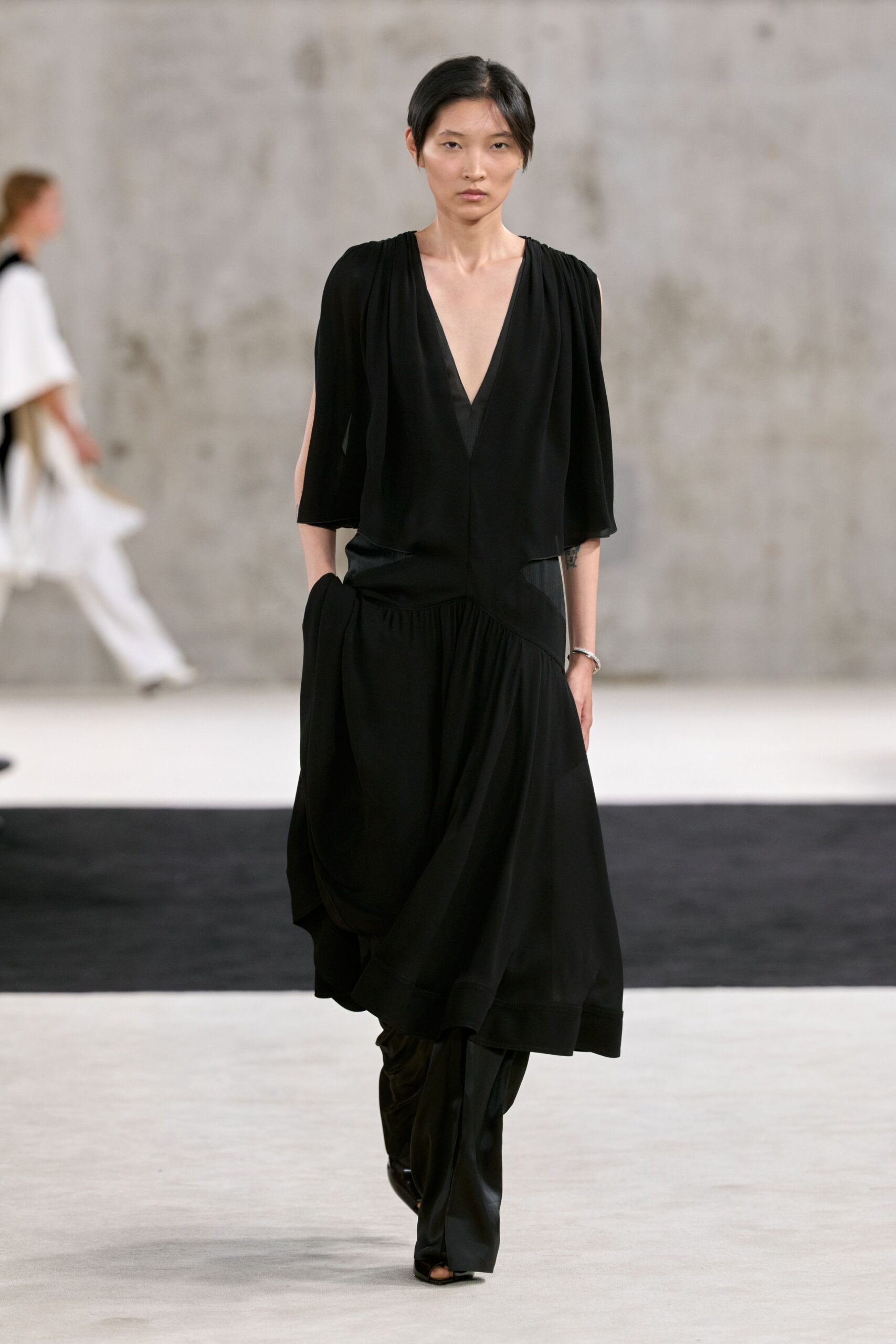 black cape-sleeve evening gown