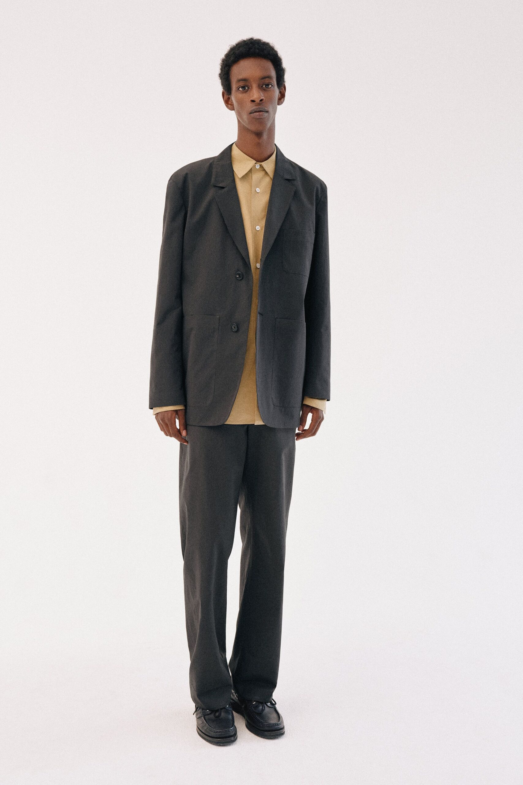 yellow long-sleeve collared buttoned shirt