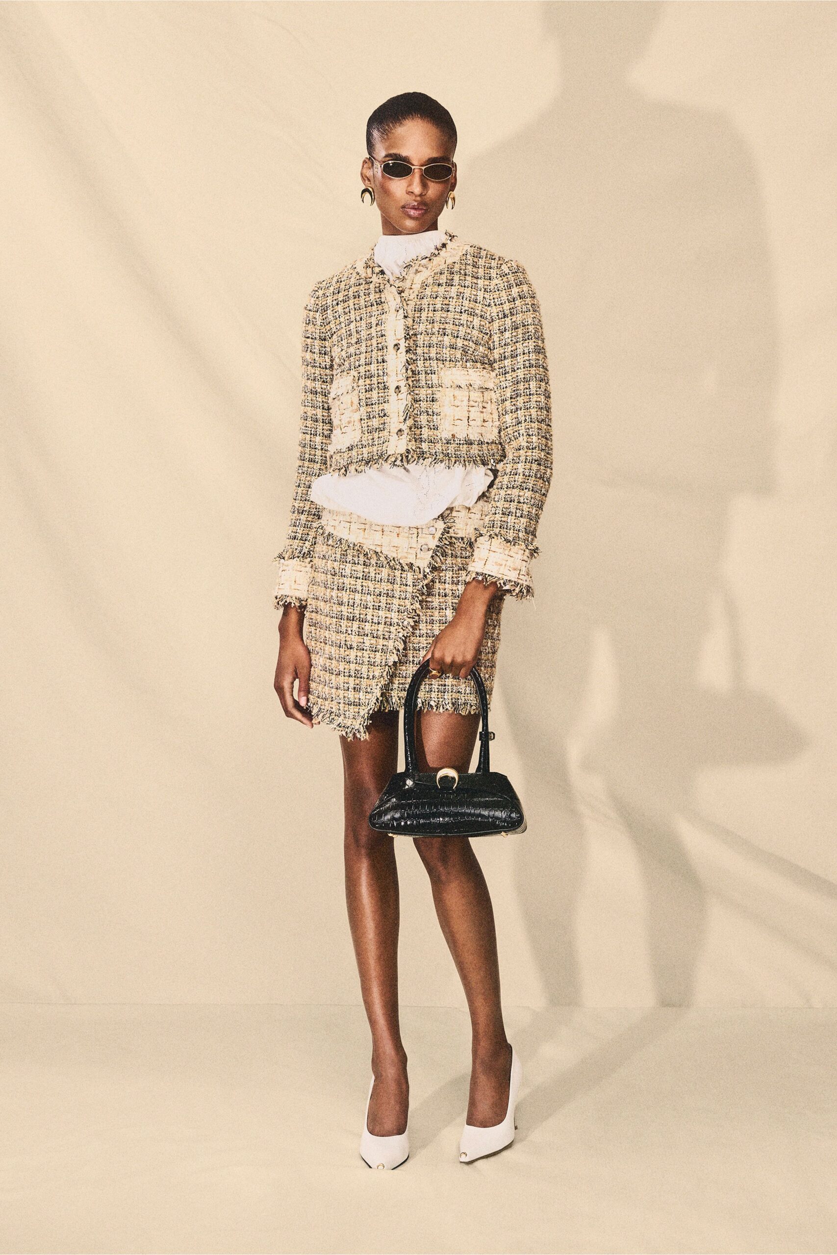 cropped tweed jacket and mini skirt