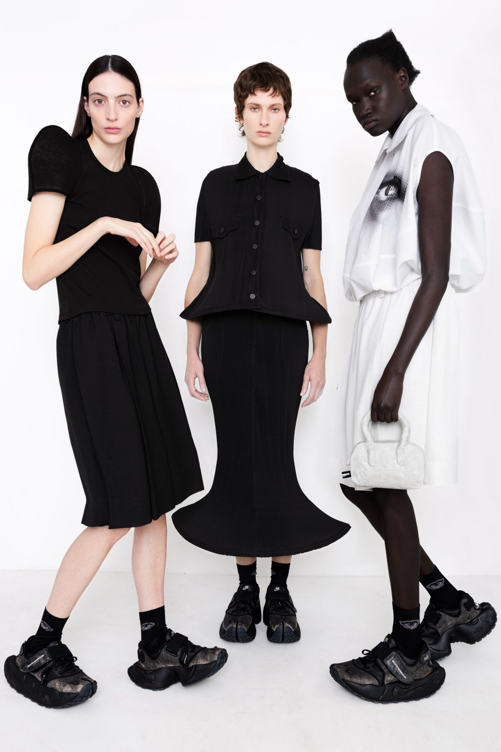 black knit short-sleeve collared structured buttoned textured shirt