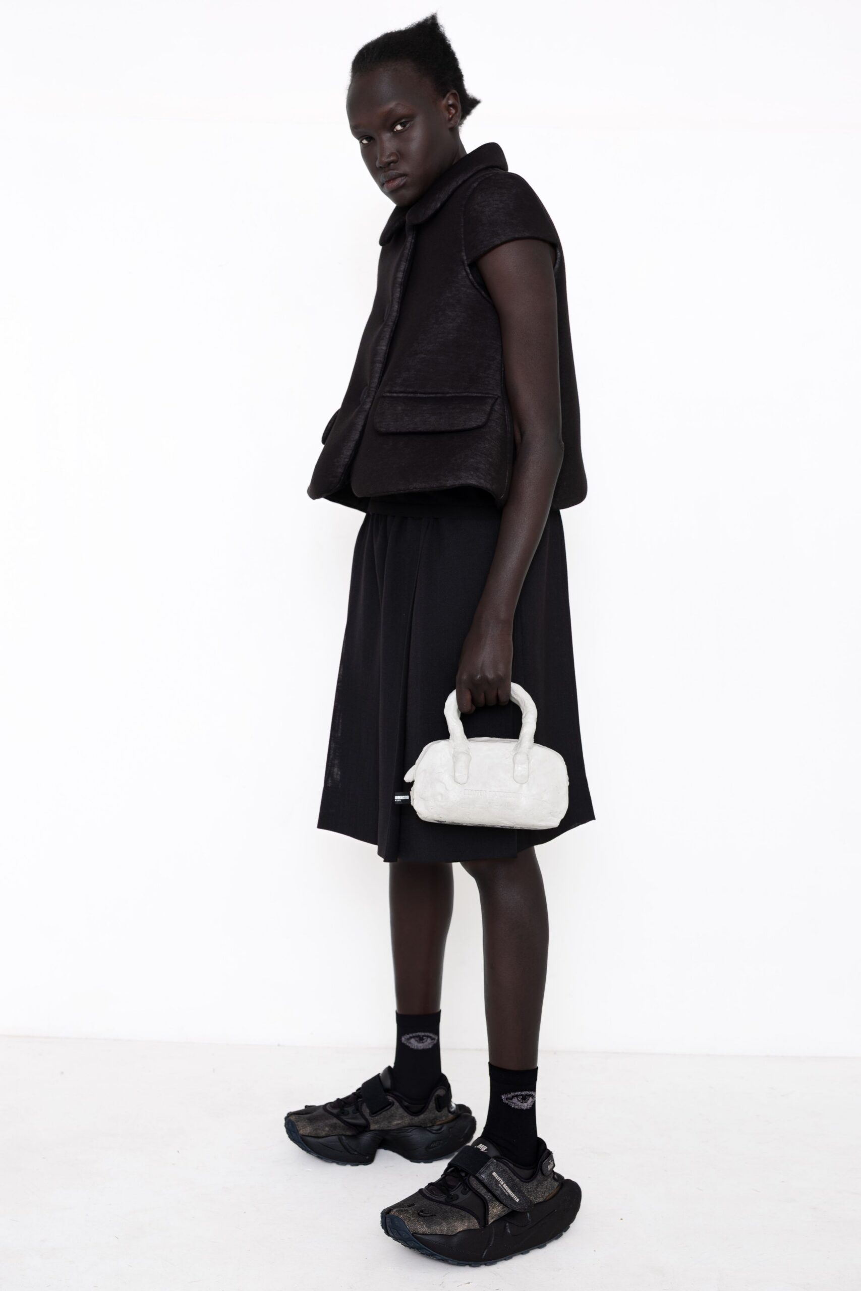 cropped cape-like black jacket