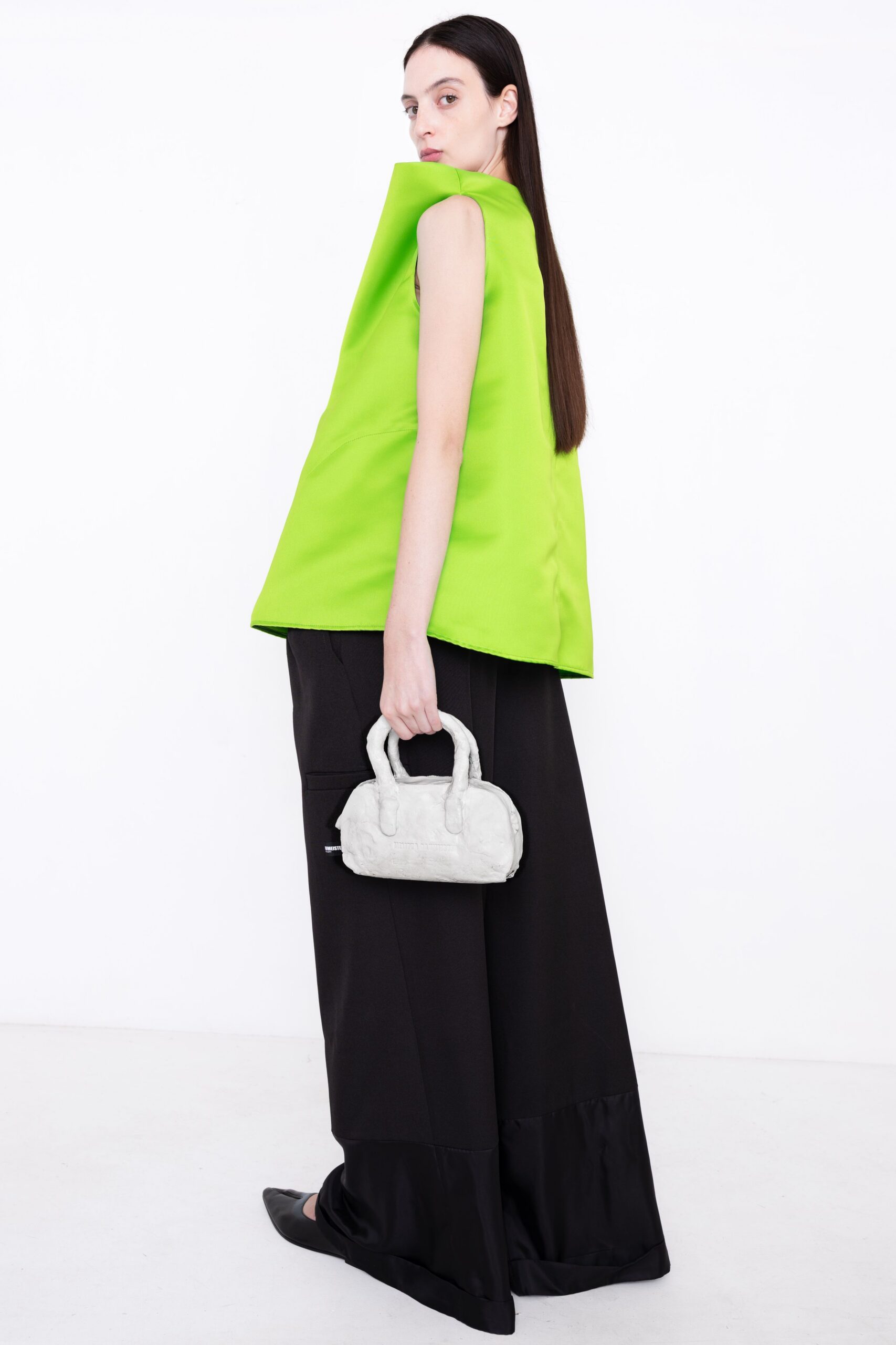 green sleeveless high-neck structured top
