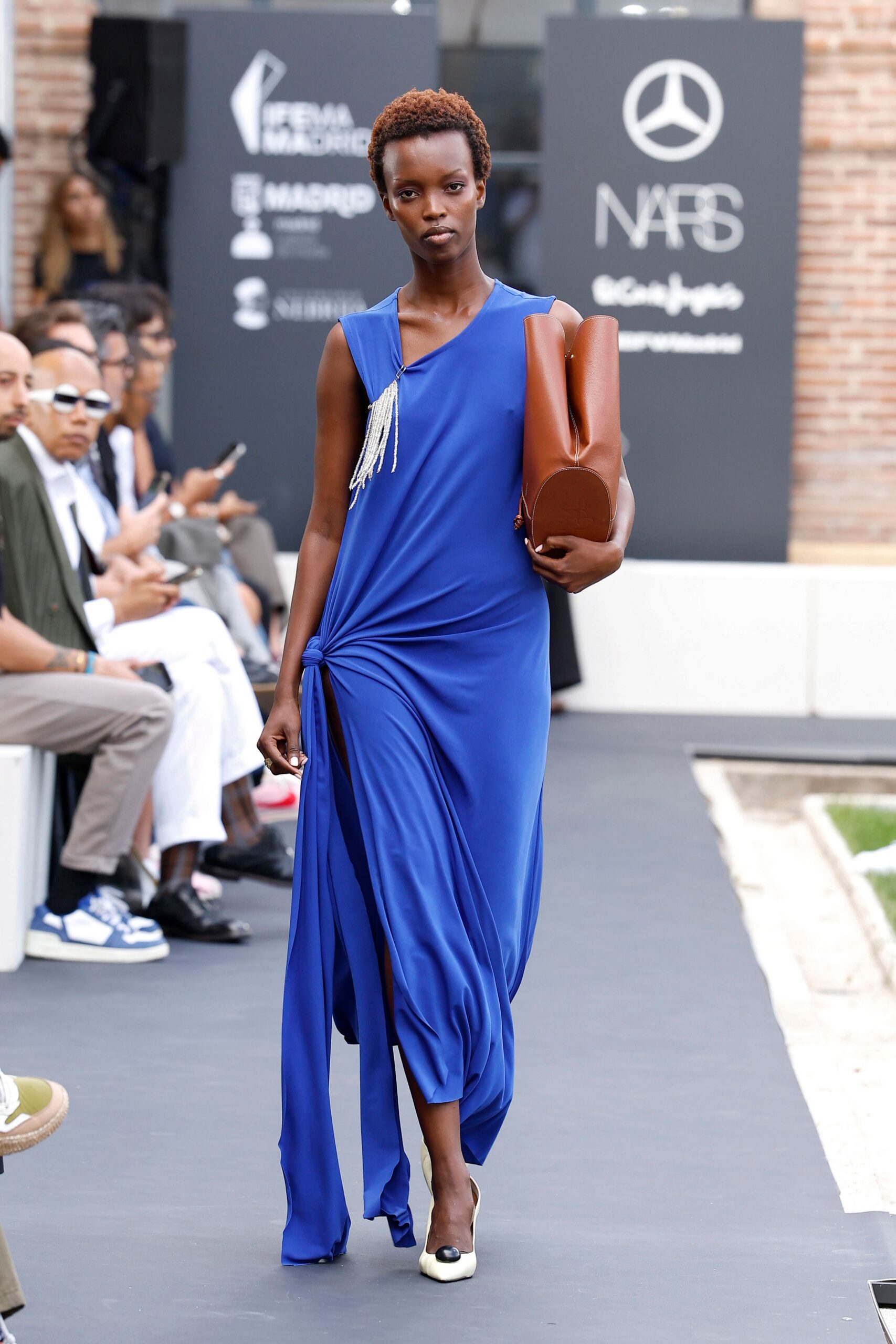 blue one-shoulder draped evening gown