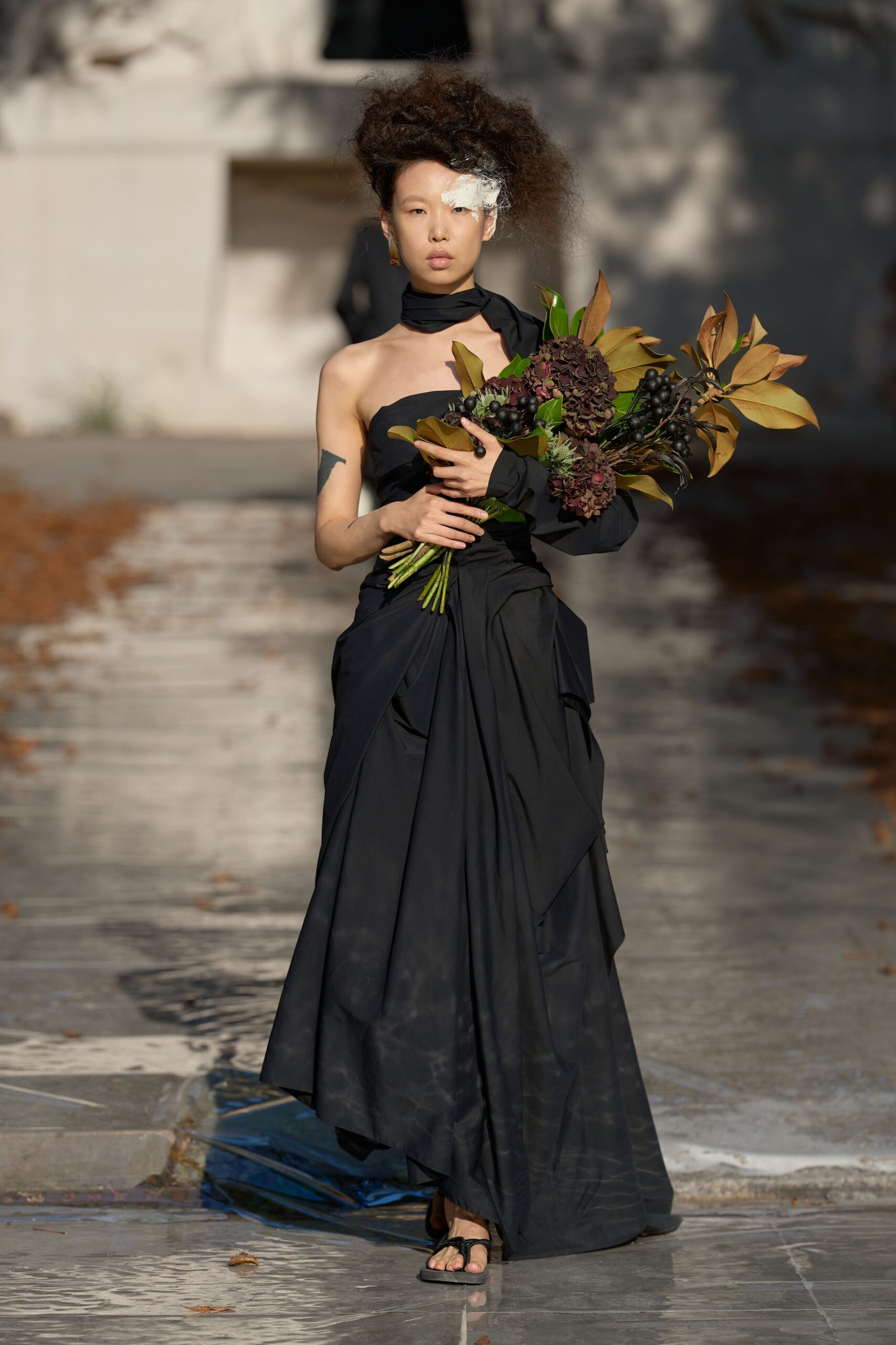 black draped strapless evening gown