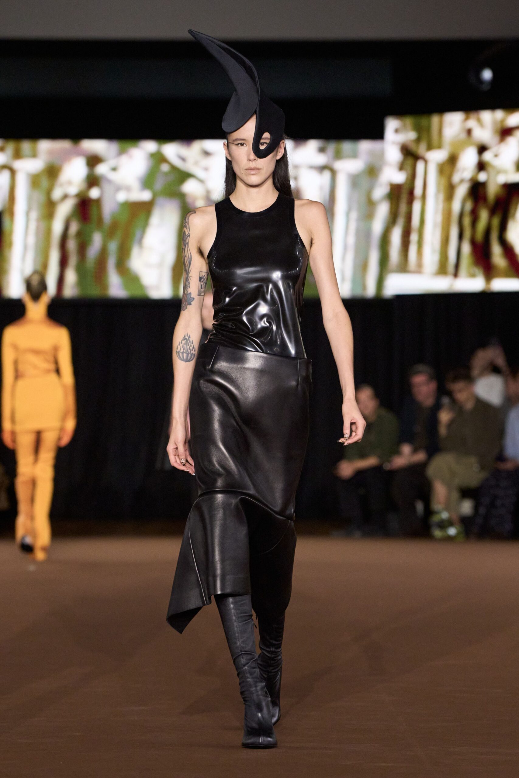 black leather sleeveless high-neck fitted draped shiny dress