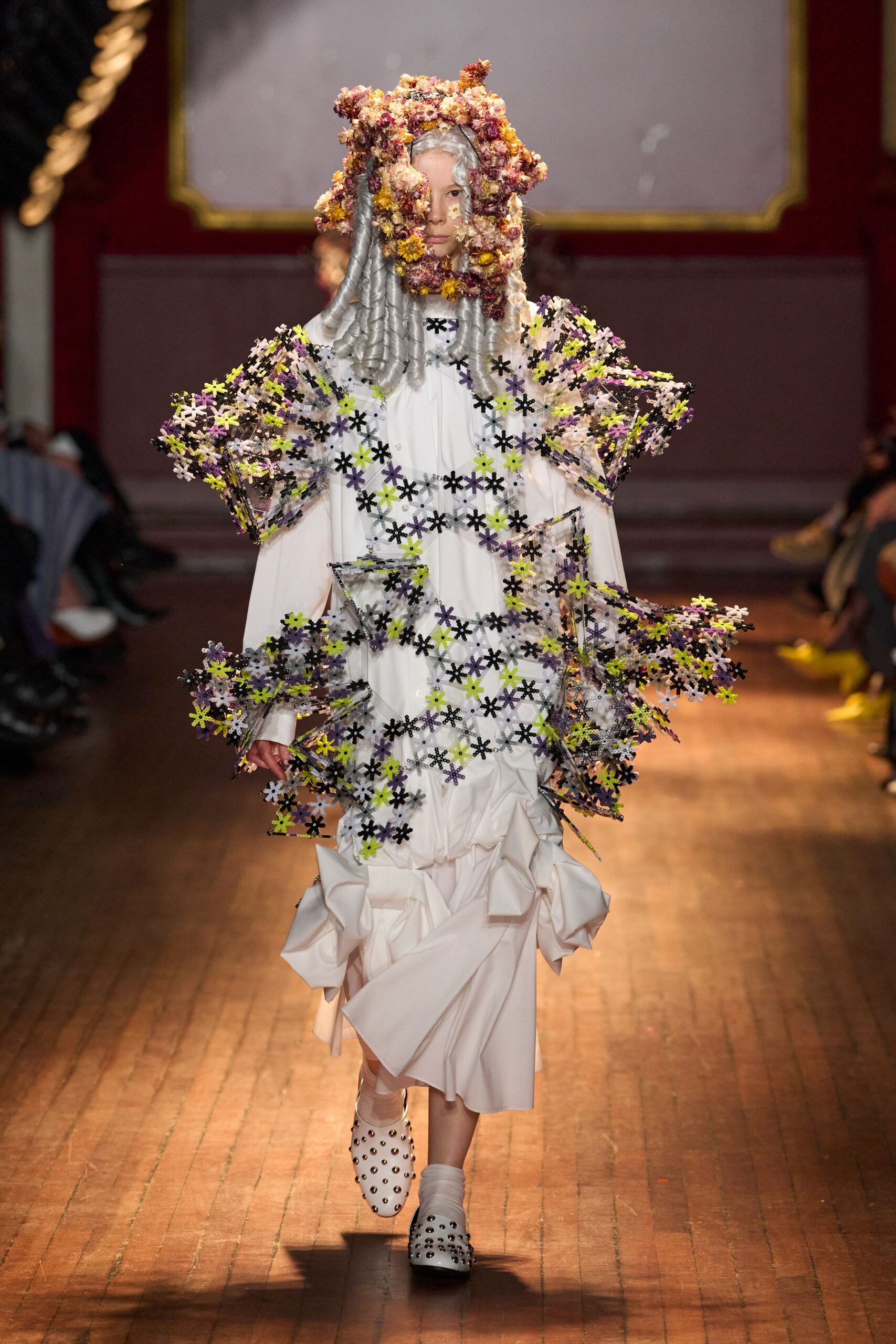 white ruched maxi dress with sculptural cape